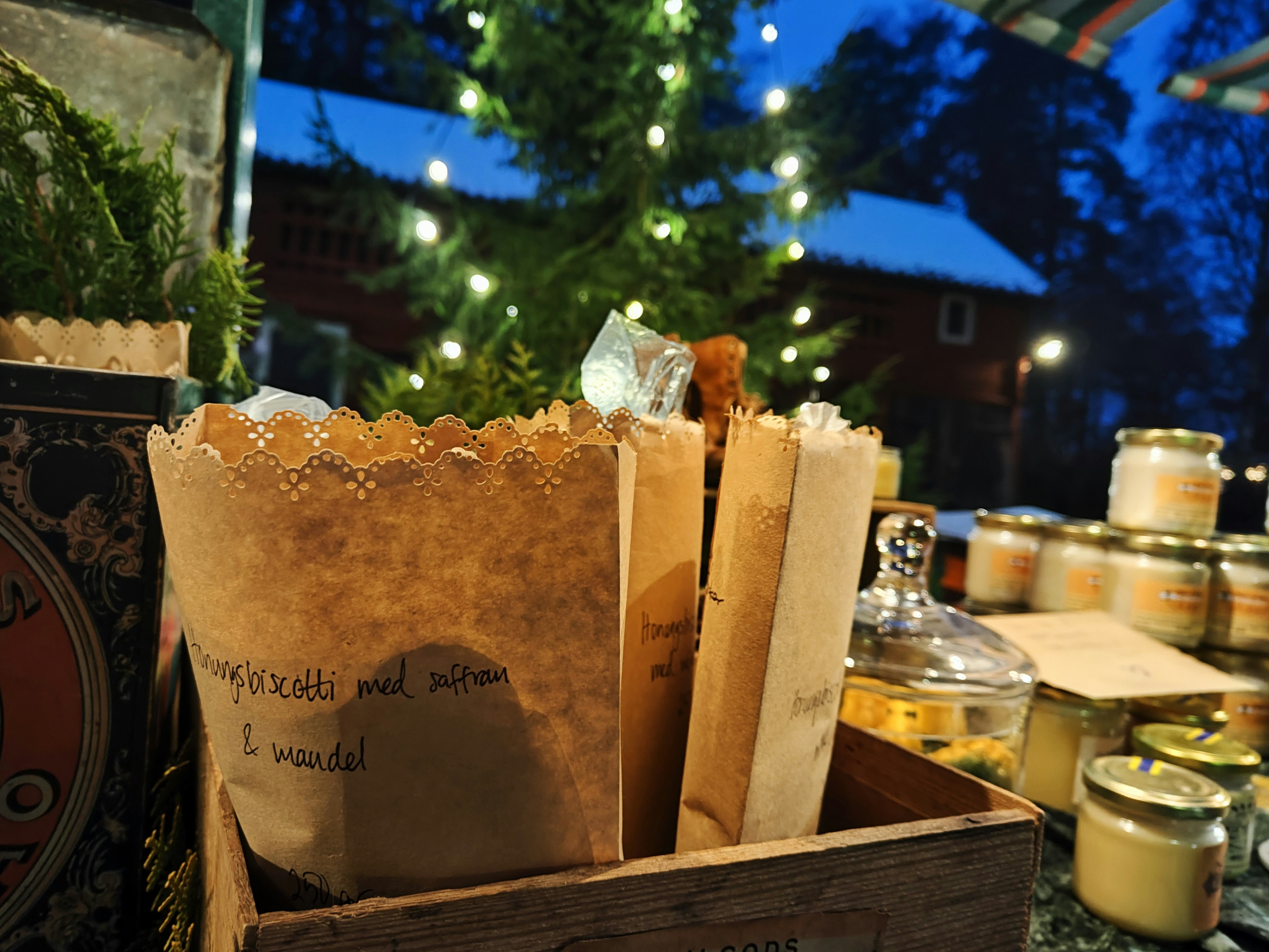 A wooden box filled with handmade wrapped items at a night market