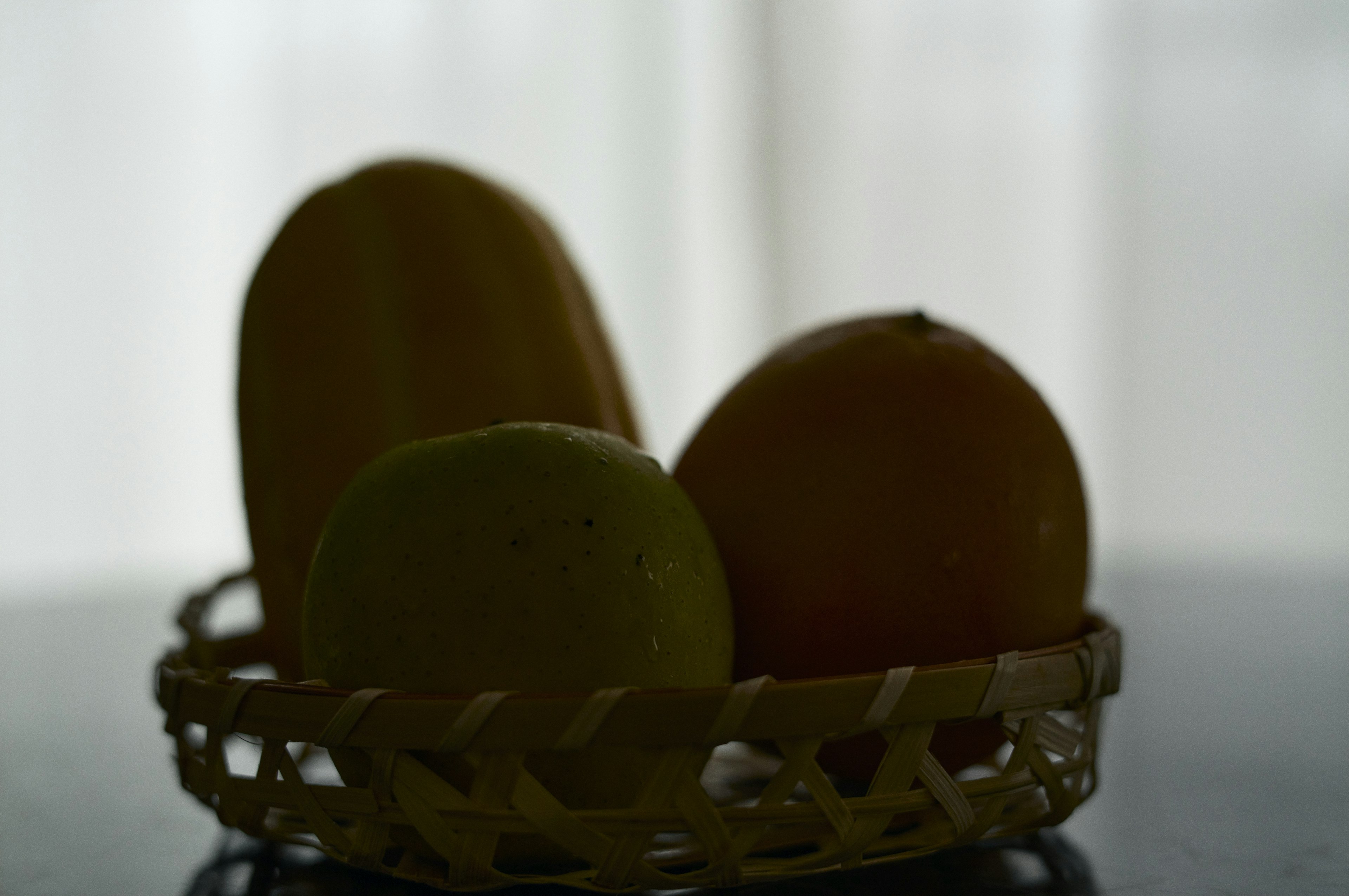 Silhouette of fruits in a wicker basket