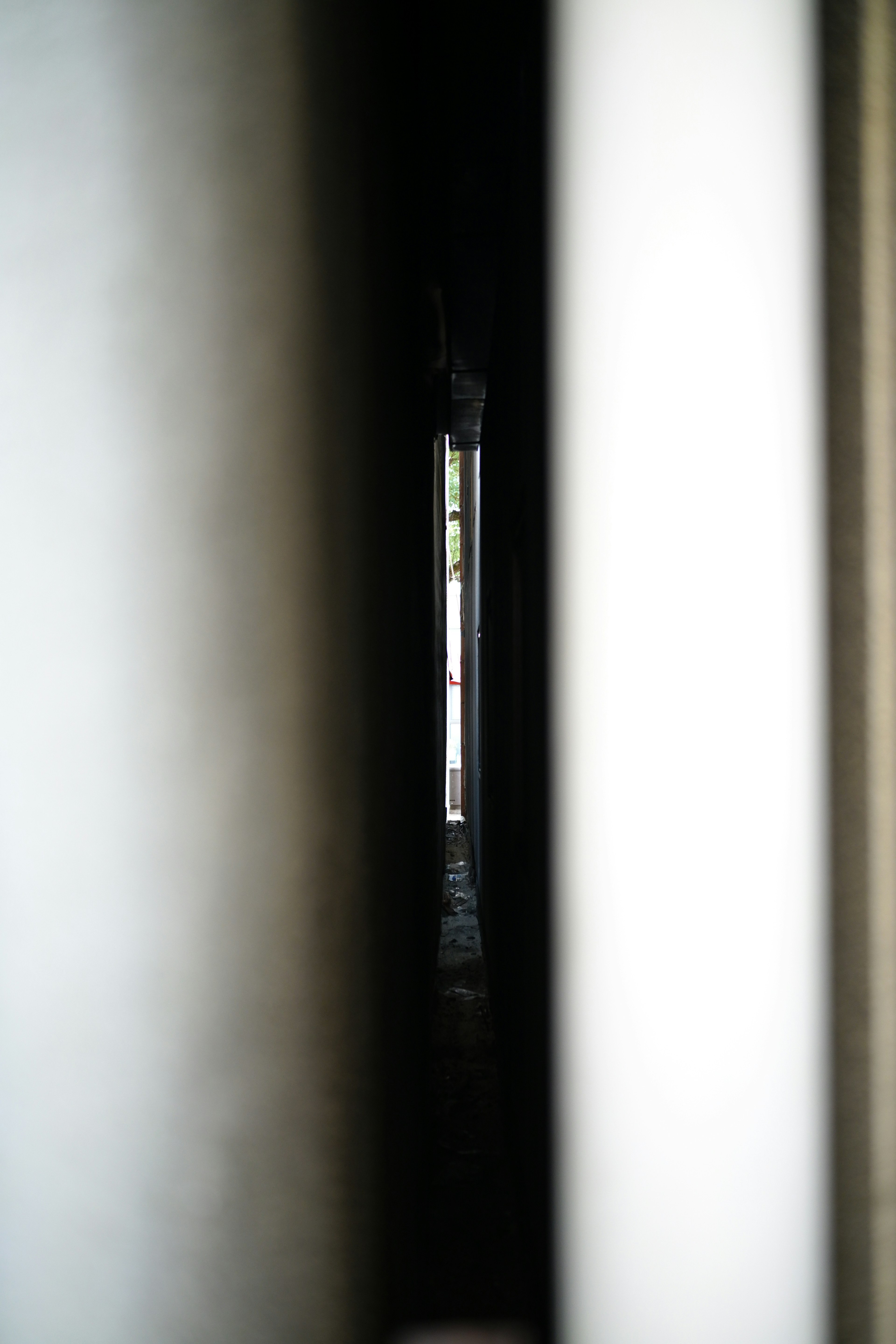 Narrow beam of light visible between books