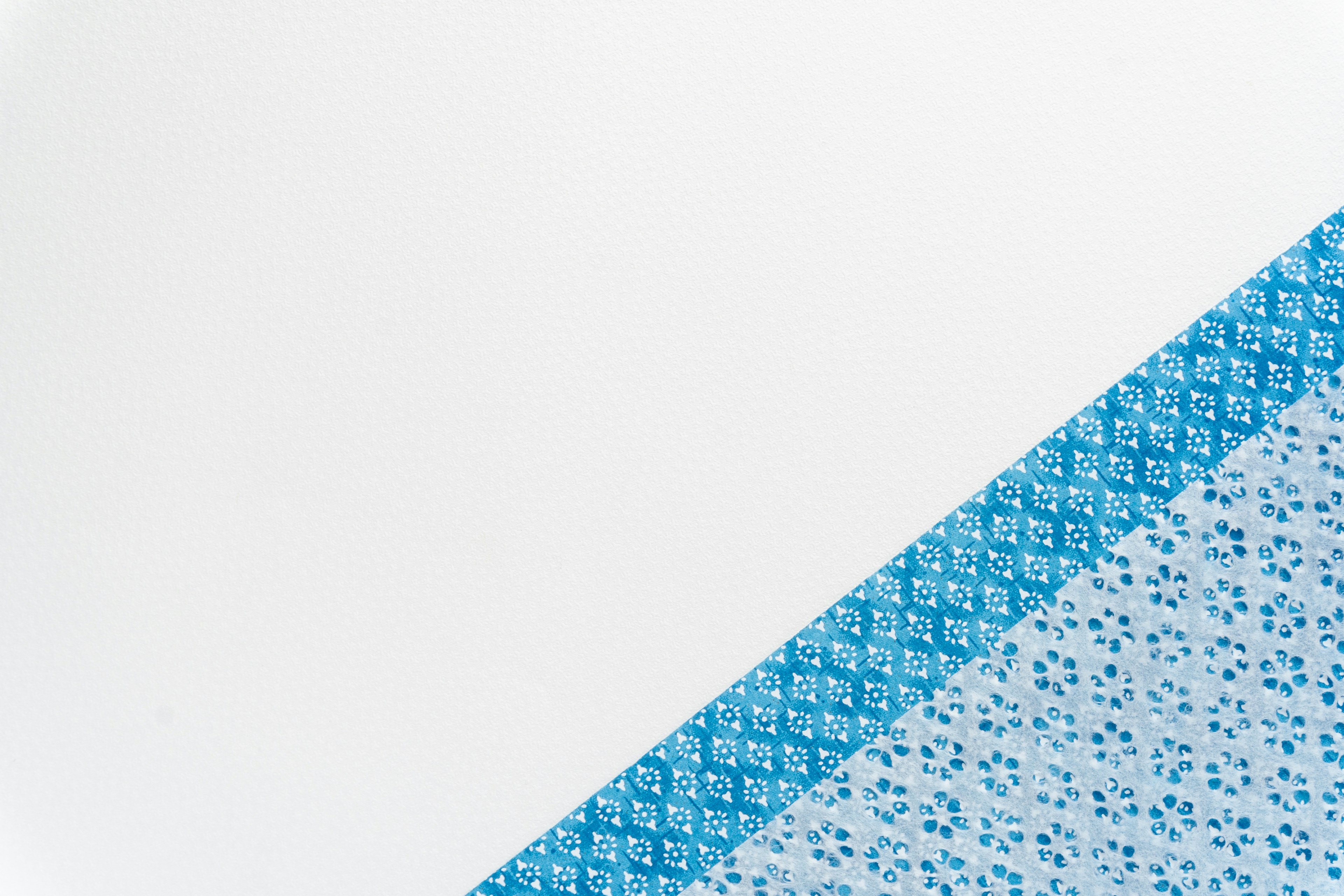 Blue patterned design with a white background