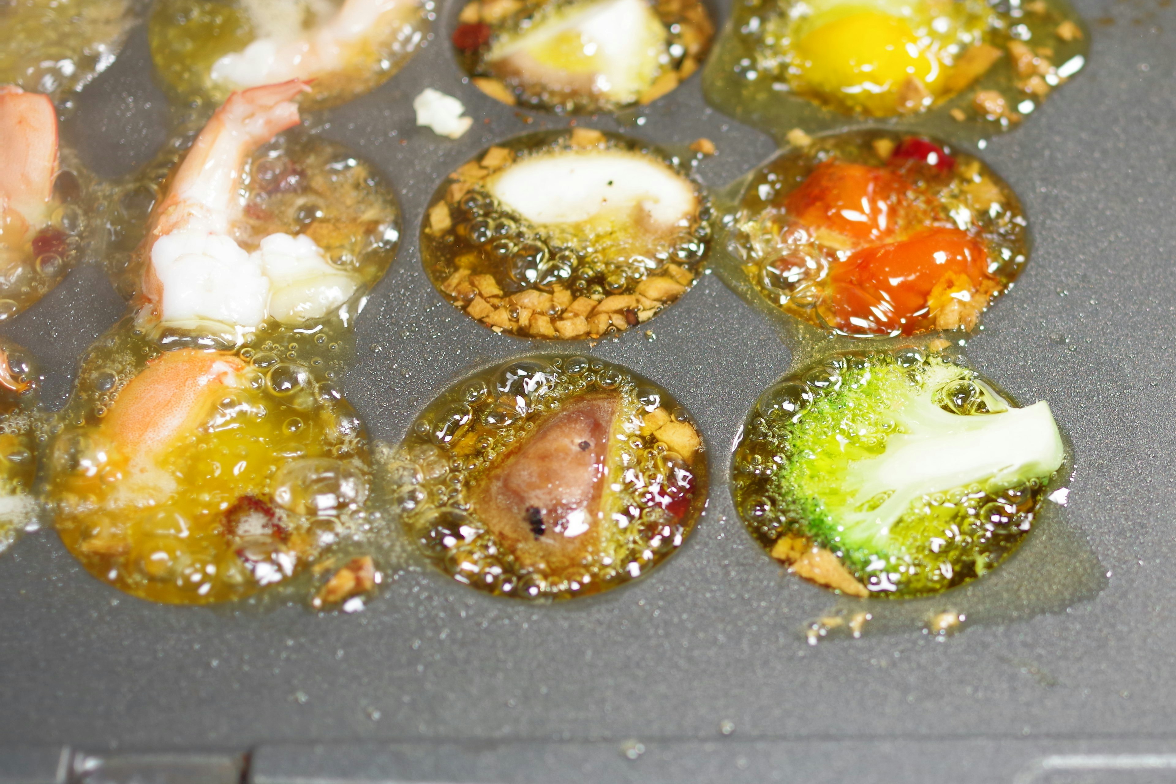 Fried circular food items arranged on a cooking surface