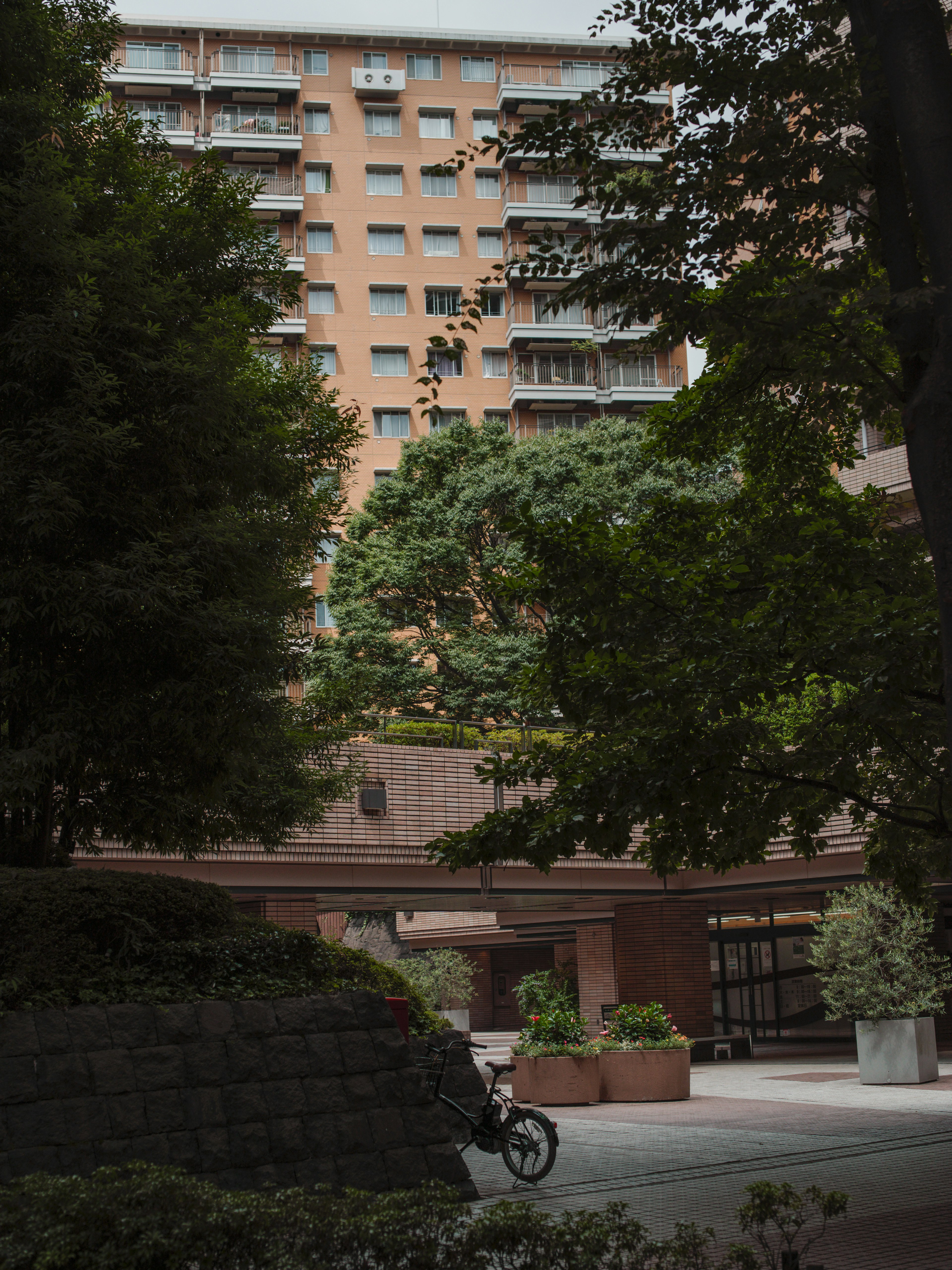 Urban landscape featuring a high-rise building and landscaped garden