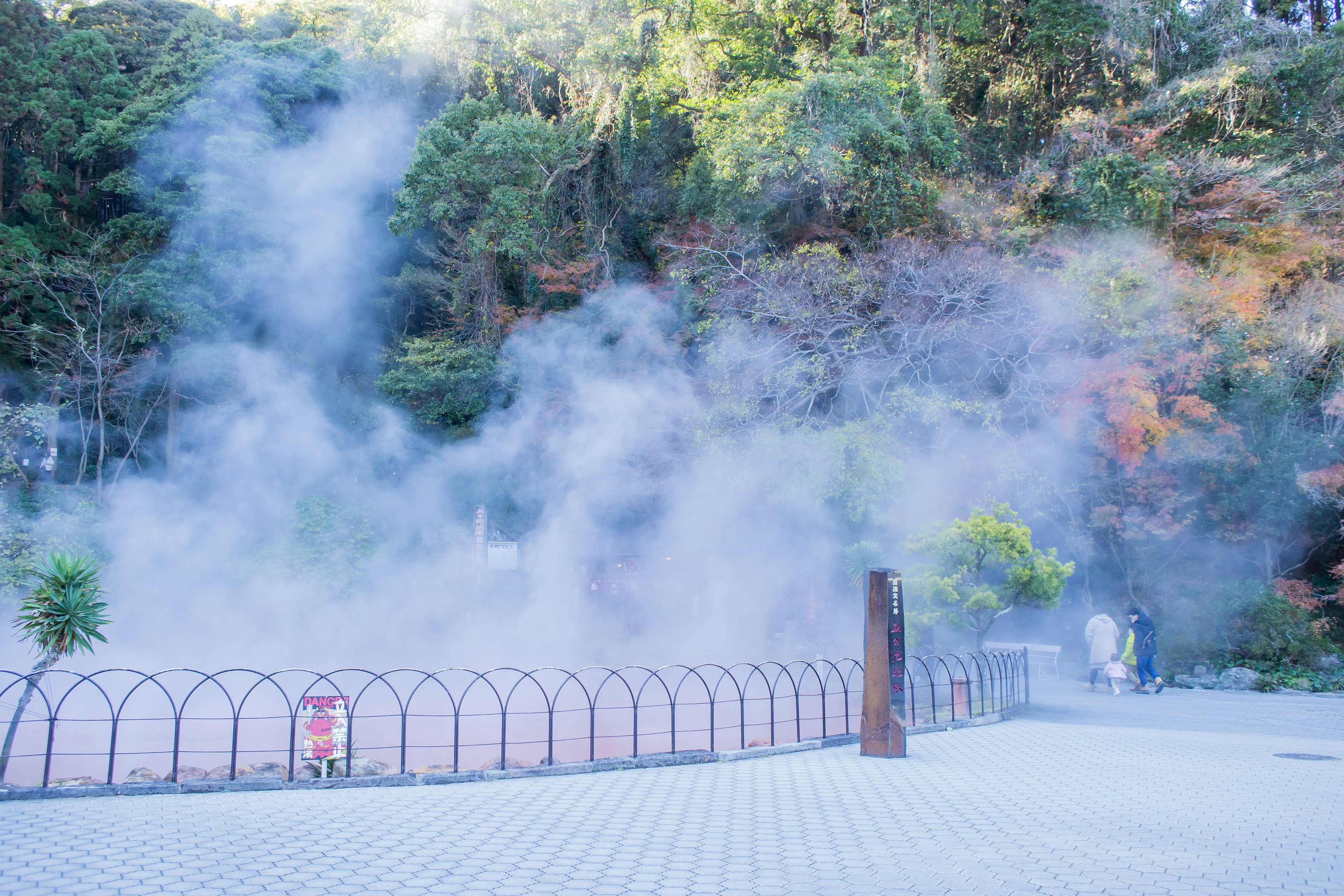 Scenic view of a natural hot spring with rising steam