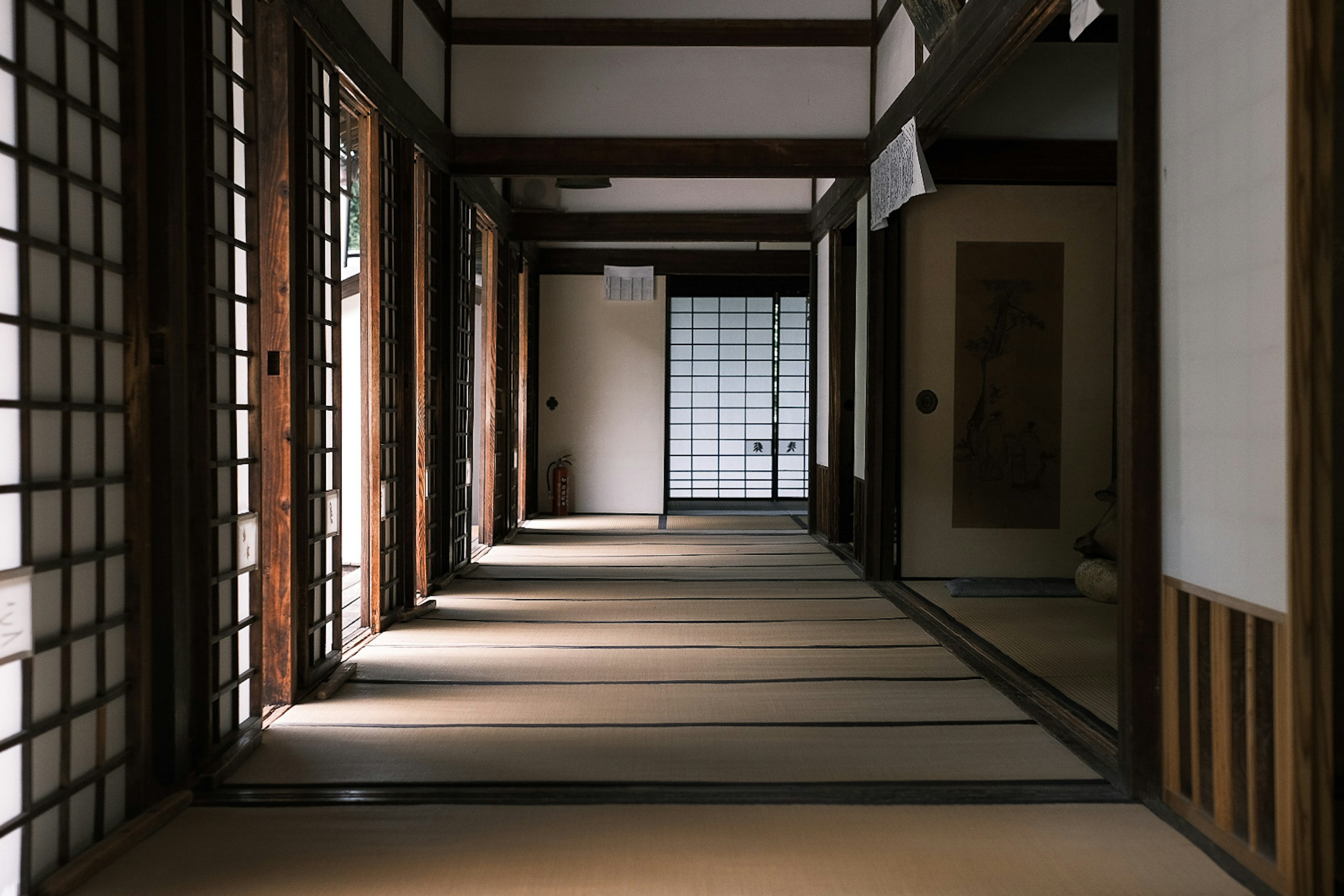 Traditional Japanese house hallway with sliding doors and tatami flooring