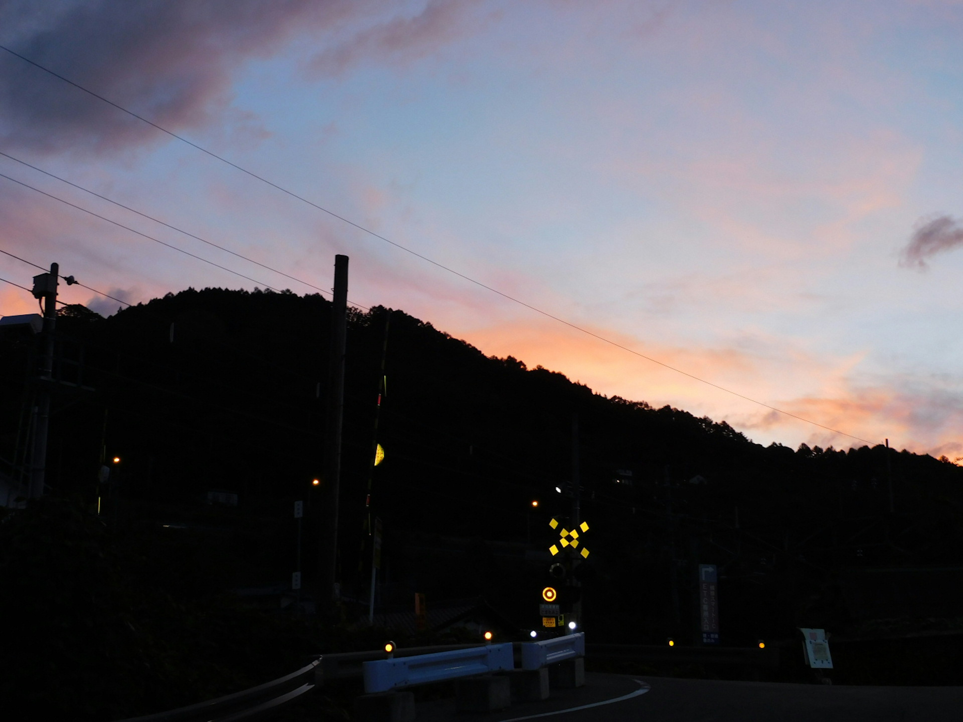 Silhouette of a mountain against a colorful sunset sky