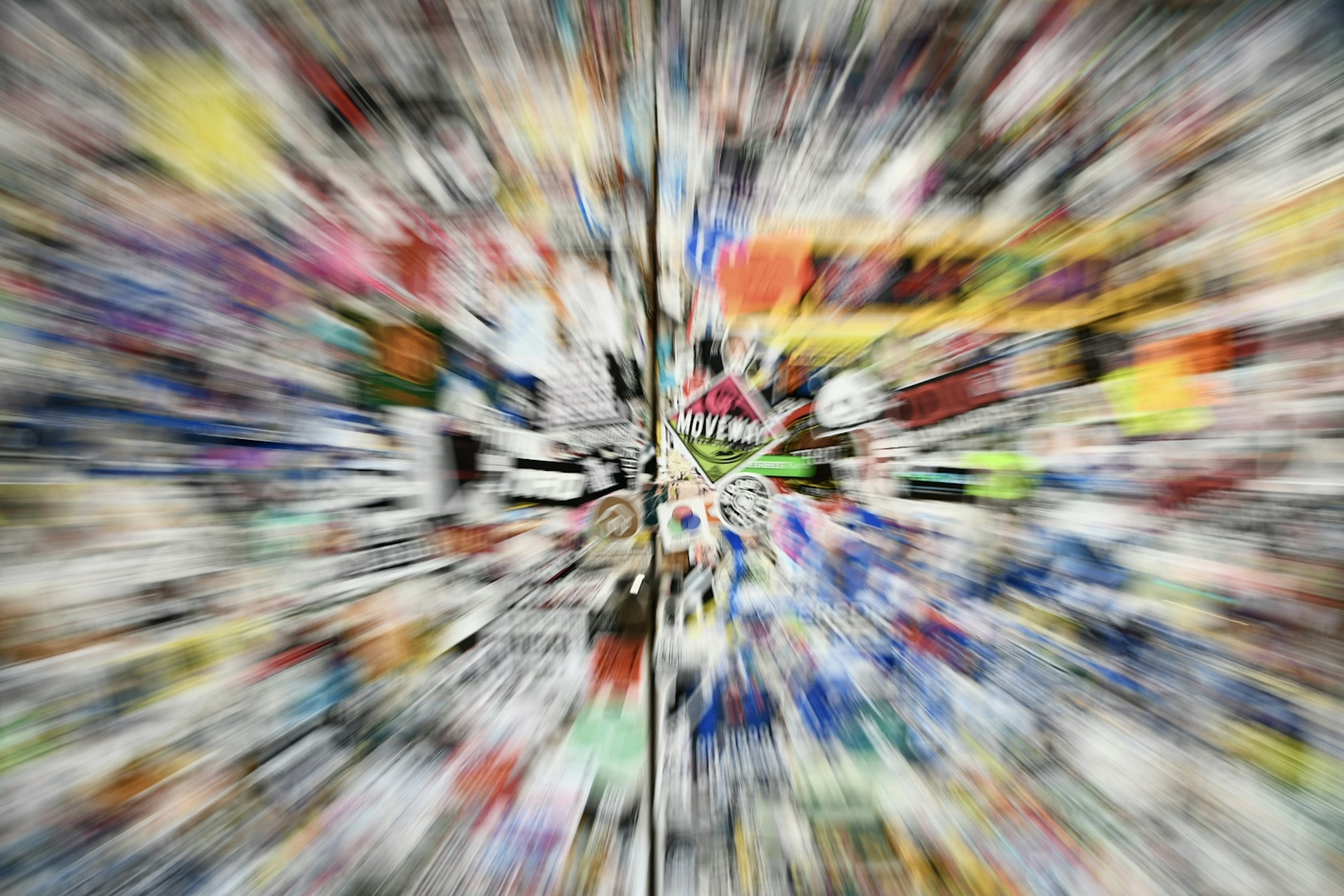 A blurred image of various colorful objects converging towards the center