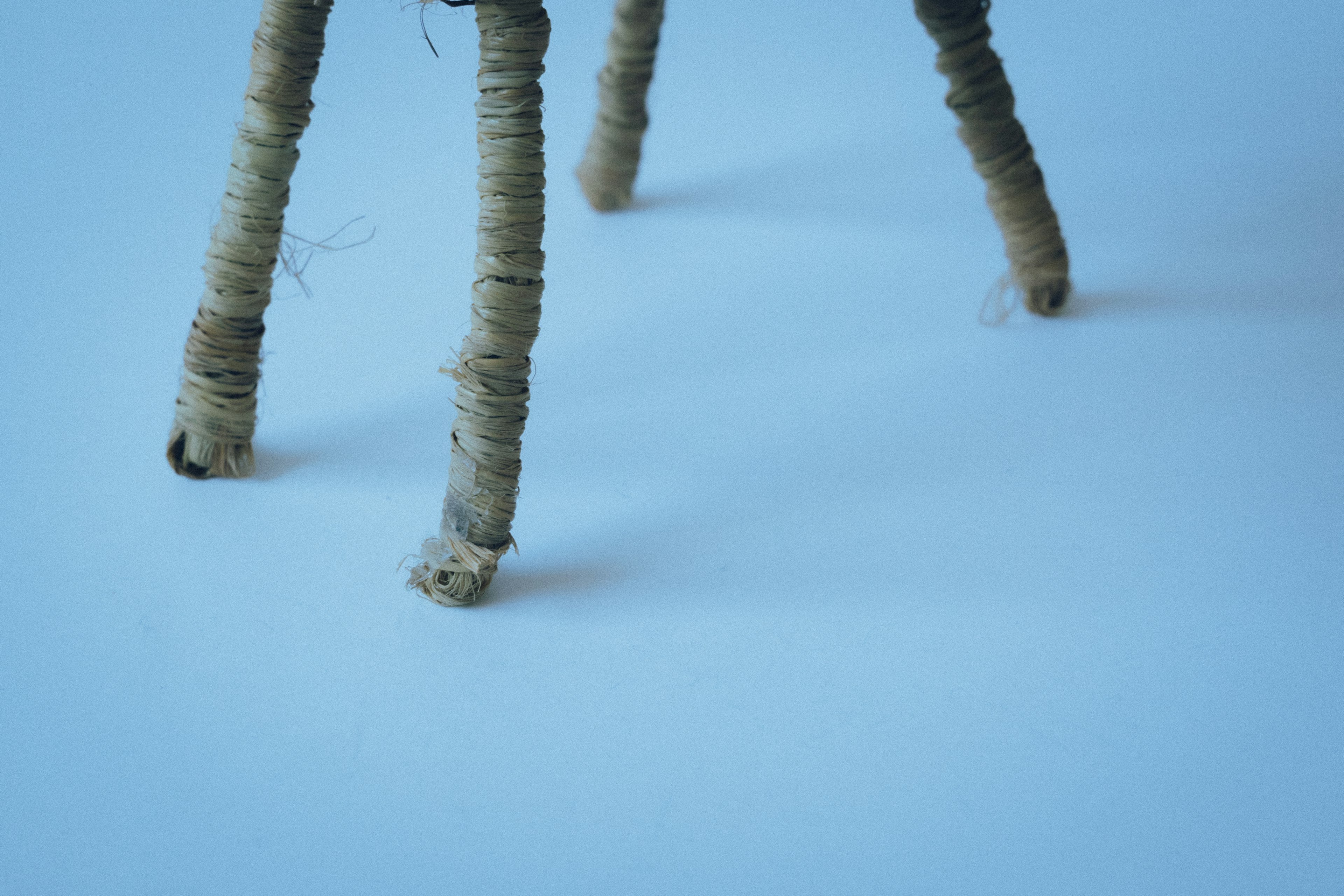 Spool-wrapped legs on a blue background