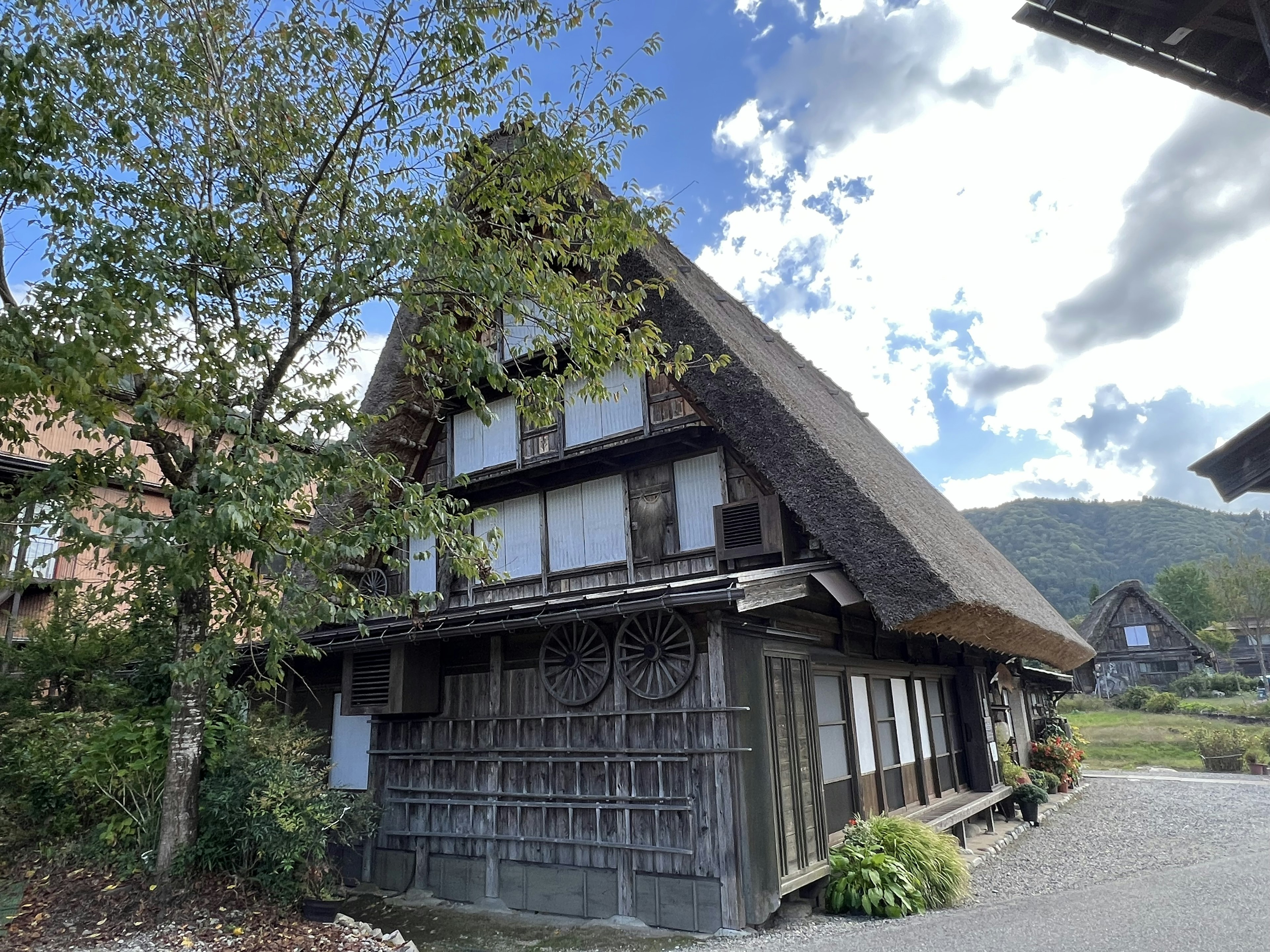 Traditional gassho-zukuri house stands under a blue sky