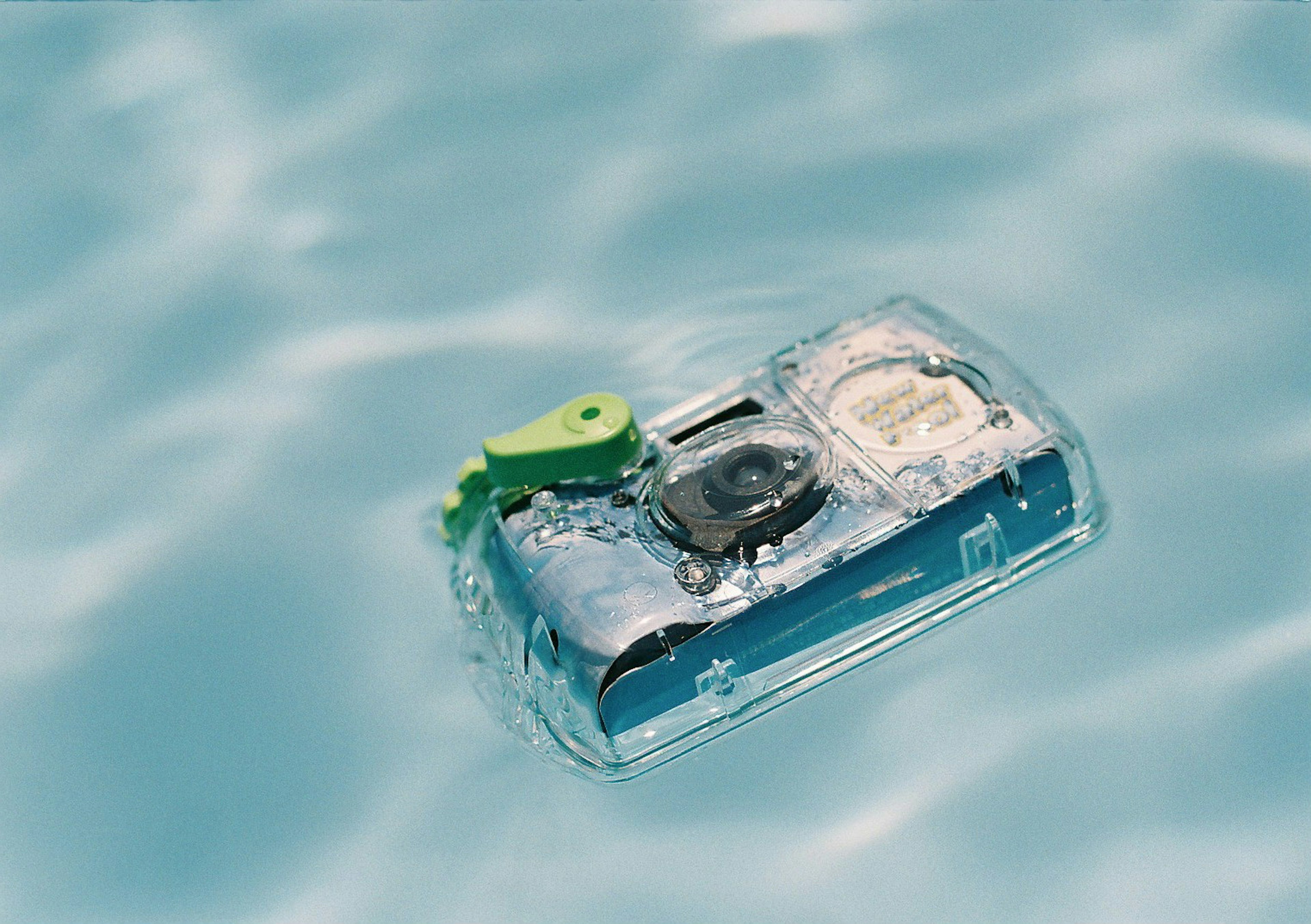 Waterproof camera floating on the surface of a pool