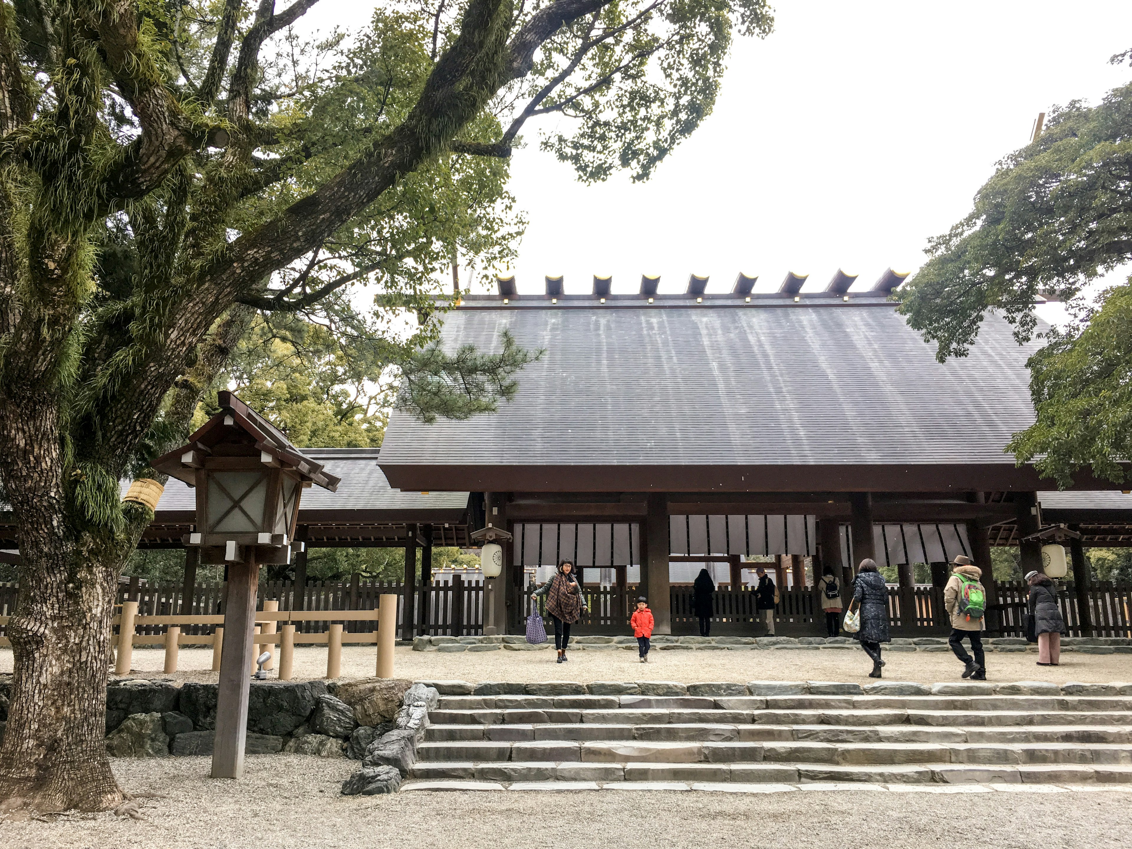 Traditional building at the entrance of a shrine with visitors