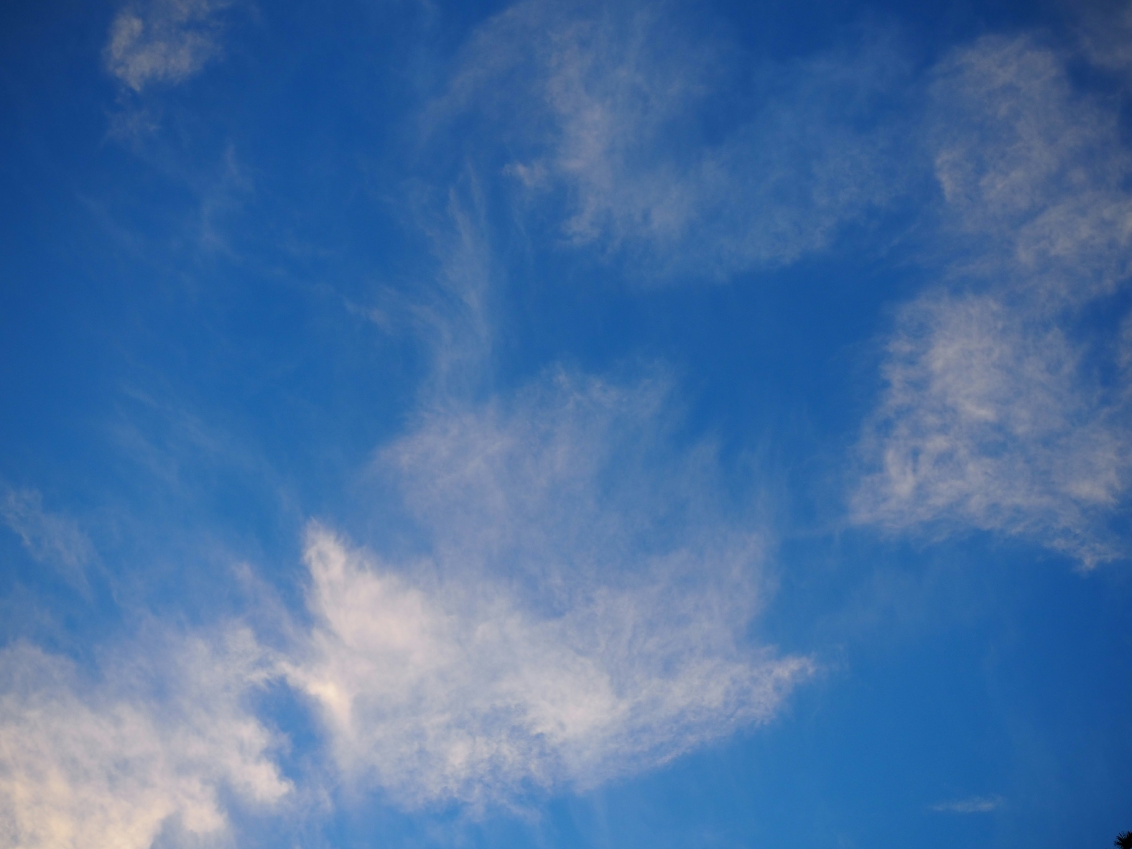 White cloud patterns in a clear blue sky