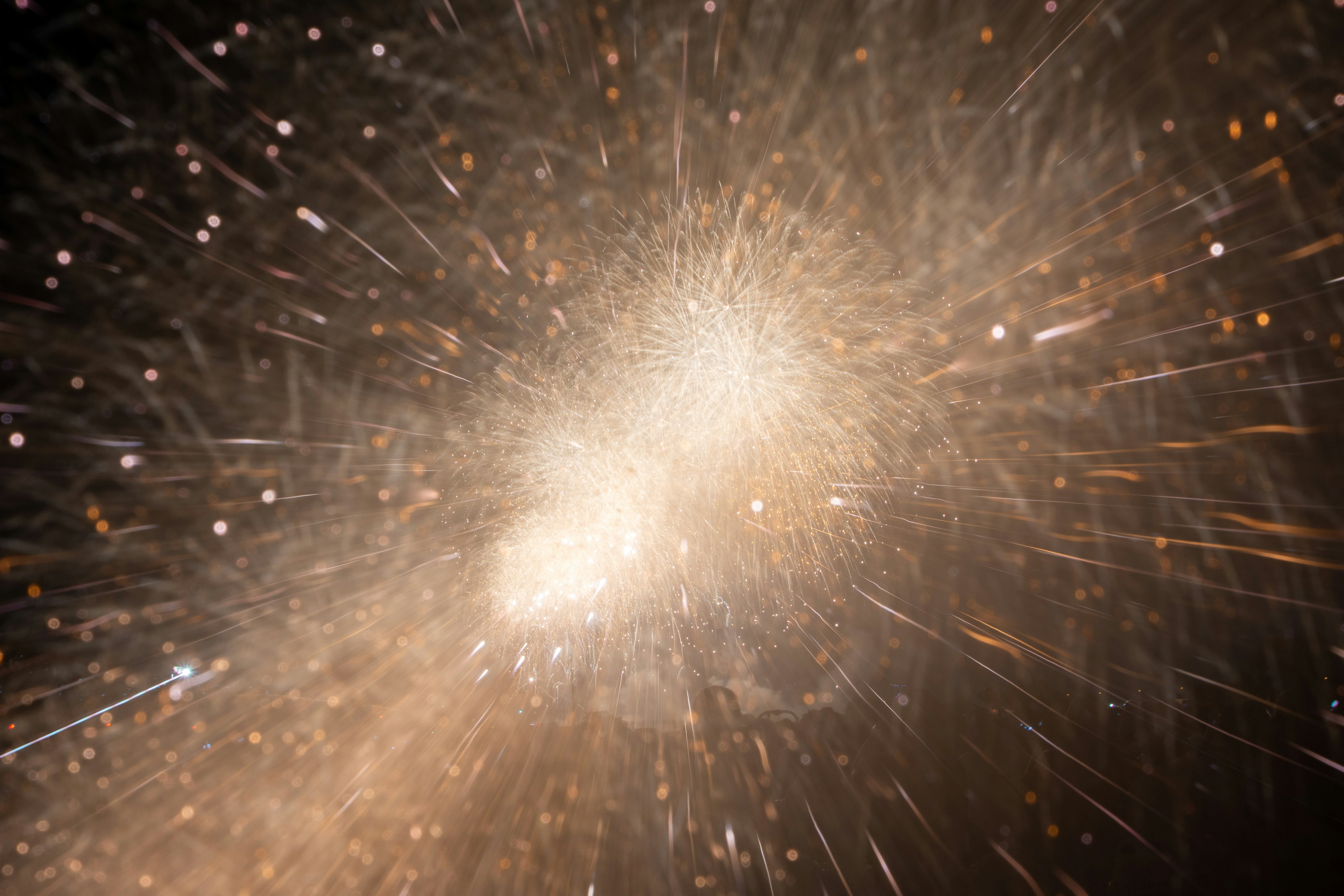 A mesmerizing background with radiant particles spreading outward