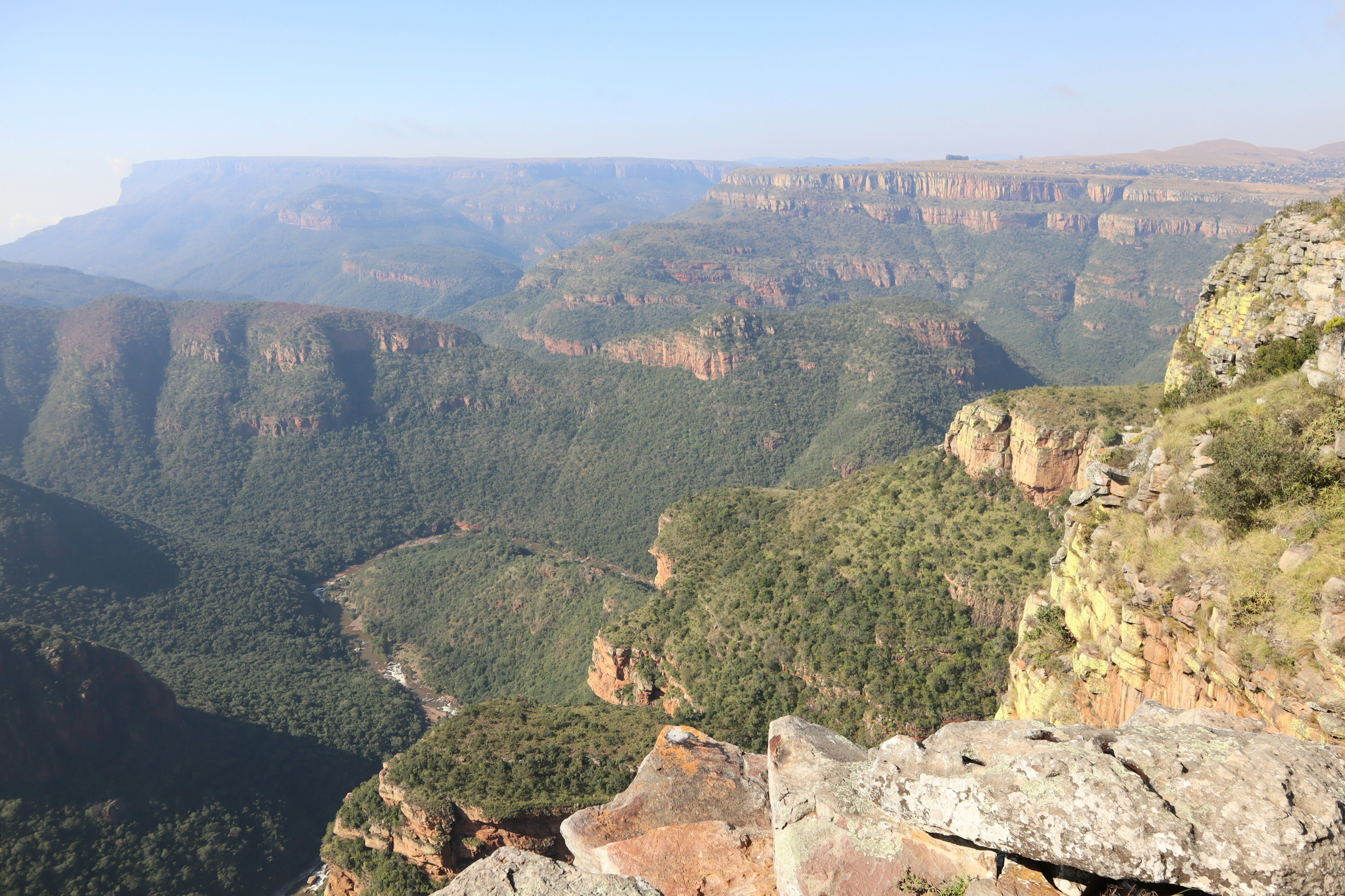 Breathtaking view of a canyon lush vegetation and rock formations