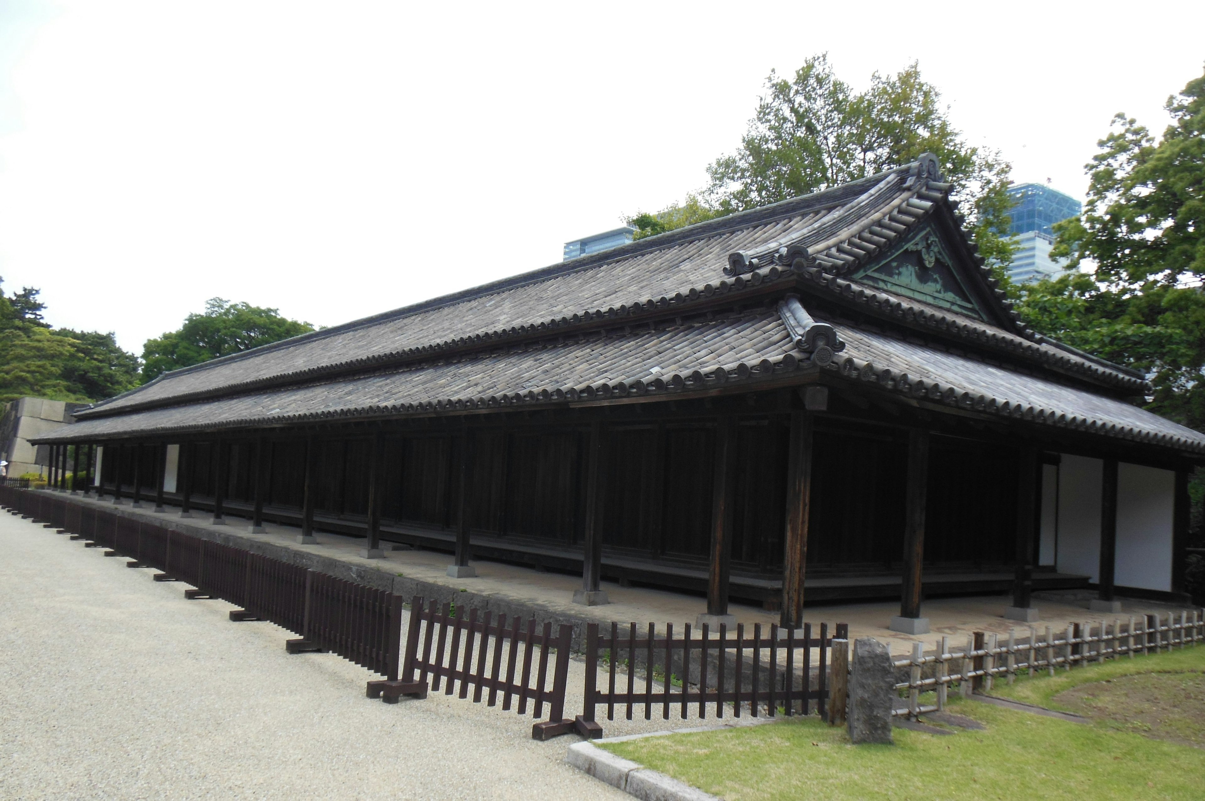 Traditional Japanese building with a black tiled roof