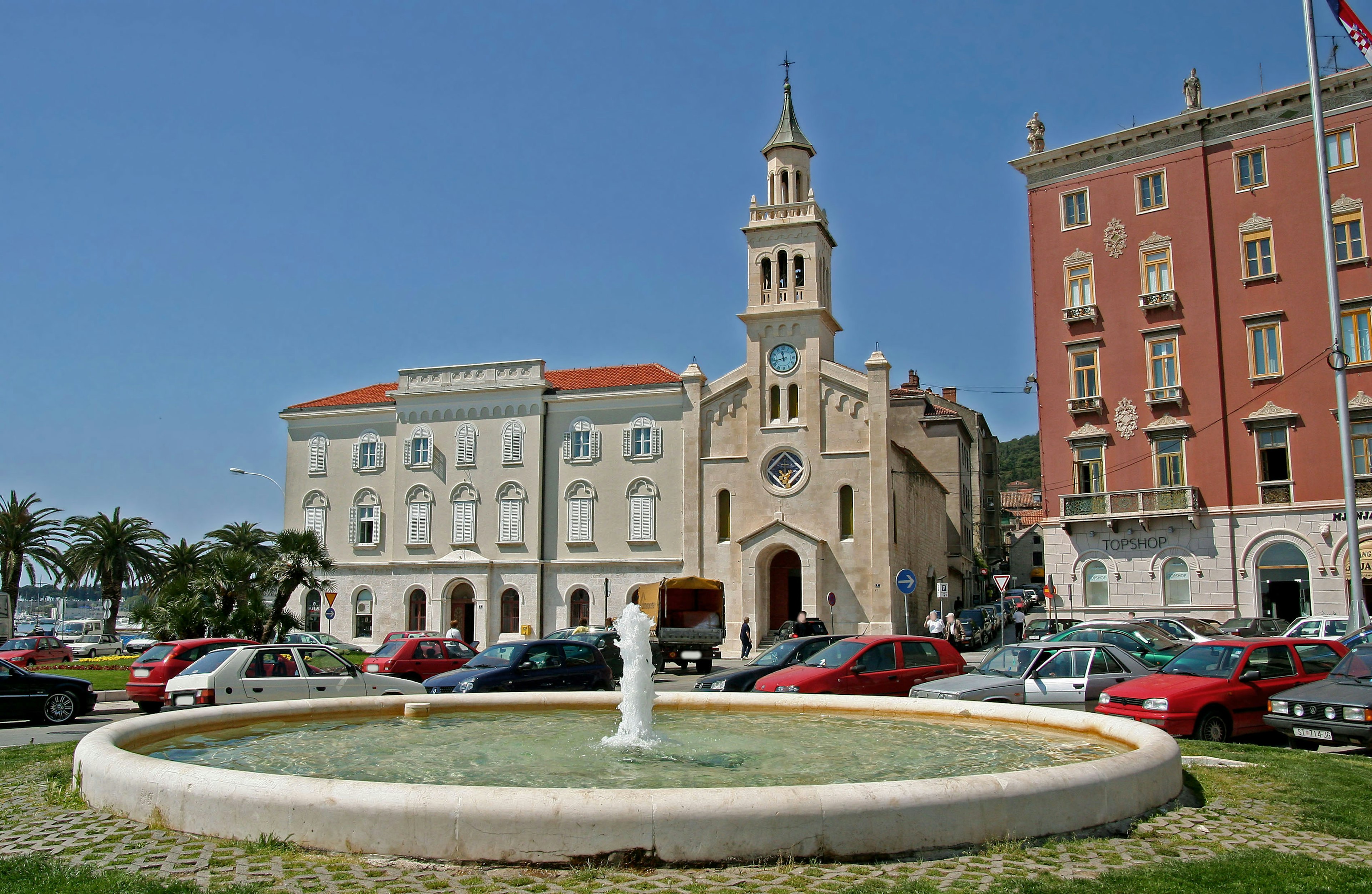 Scenic view featuring a fountain and historic buildings