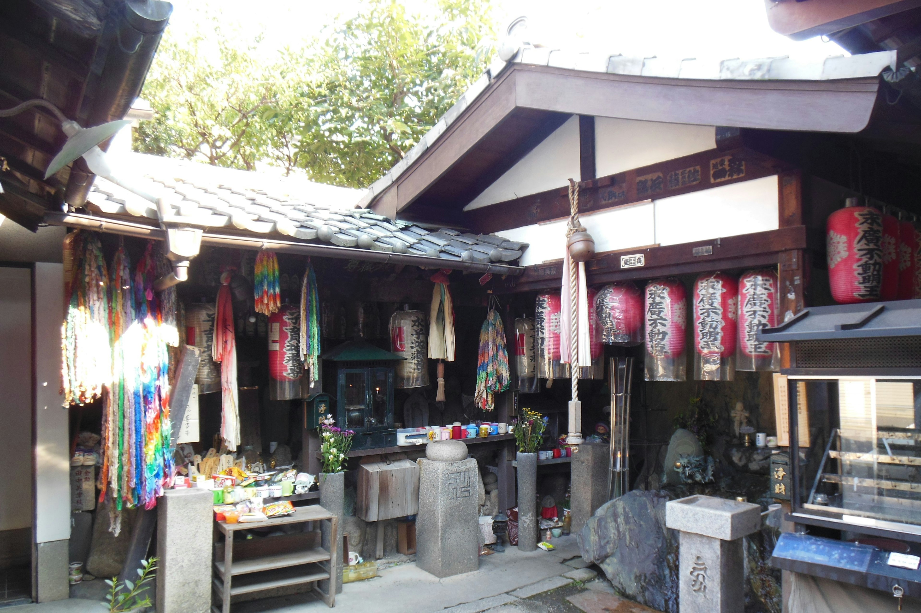 Traditional Japanese shopping street scene with colorful fabrics and goods displayed