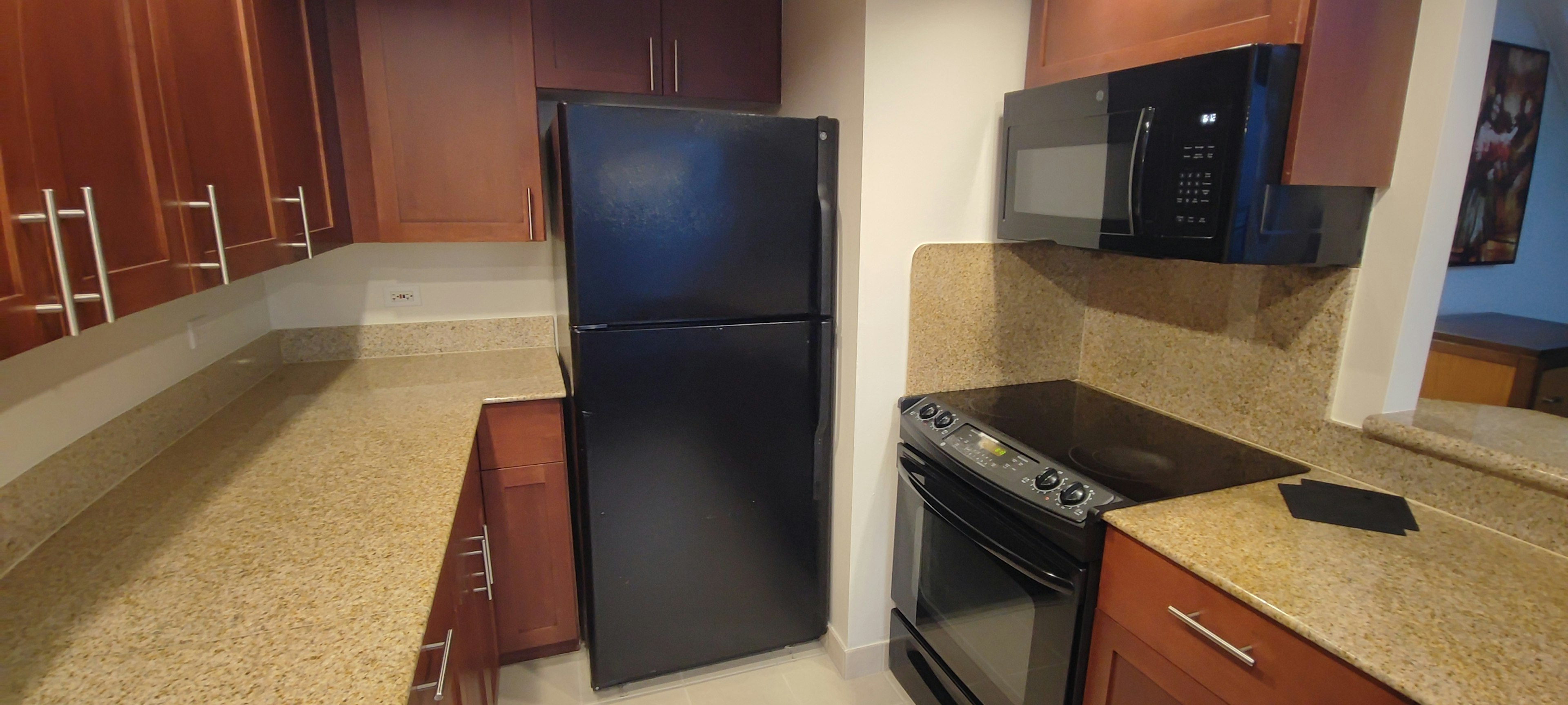 Modern kitchen featuring a black refrigerator and stove