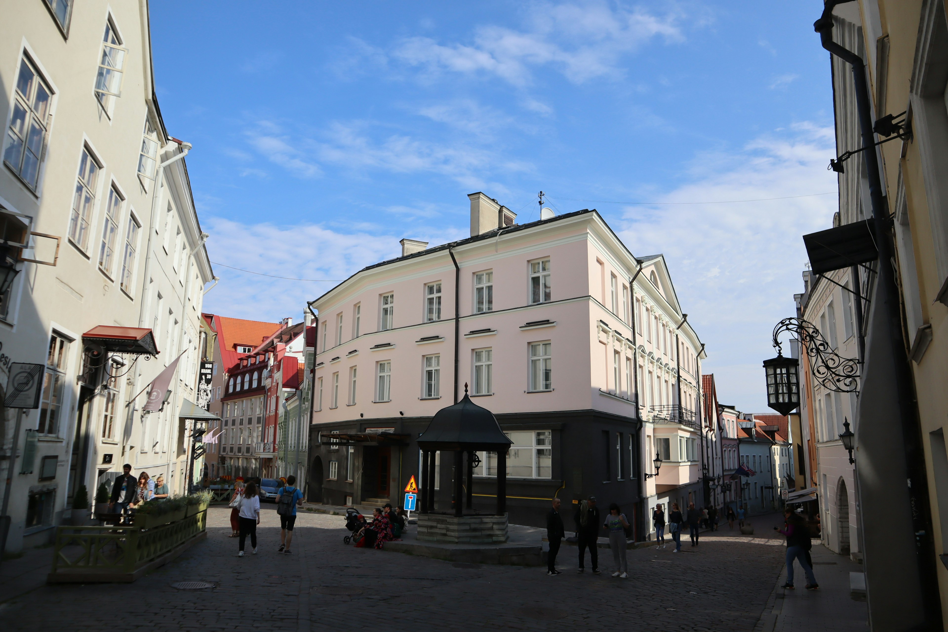 Street view featuring historical buildings under a blue sky