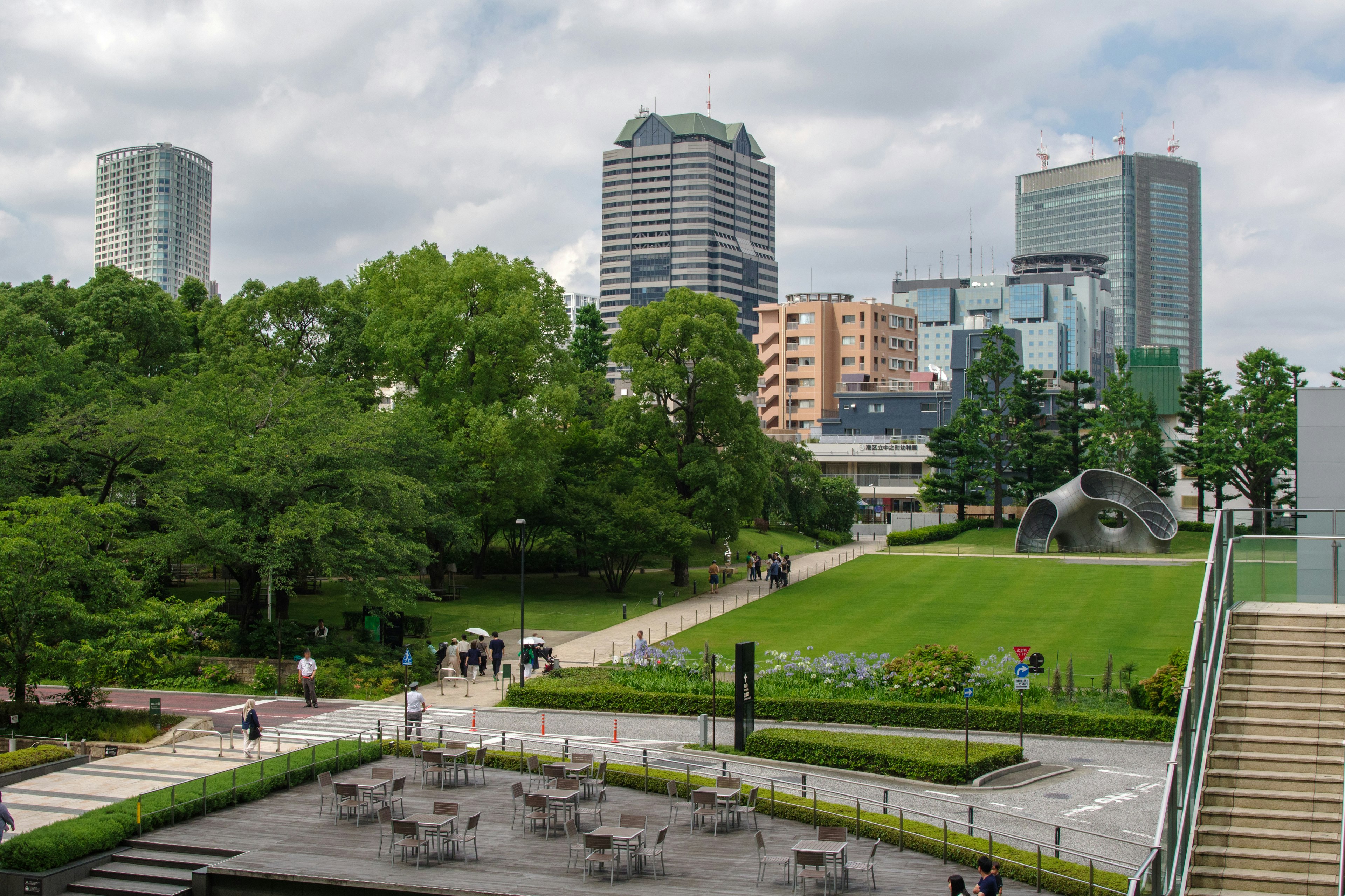 Urban landscape featuring a lush park and skyscrapers