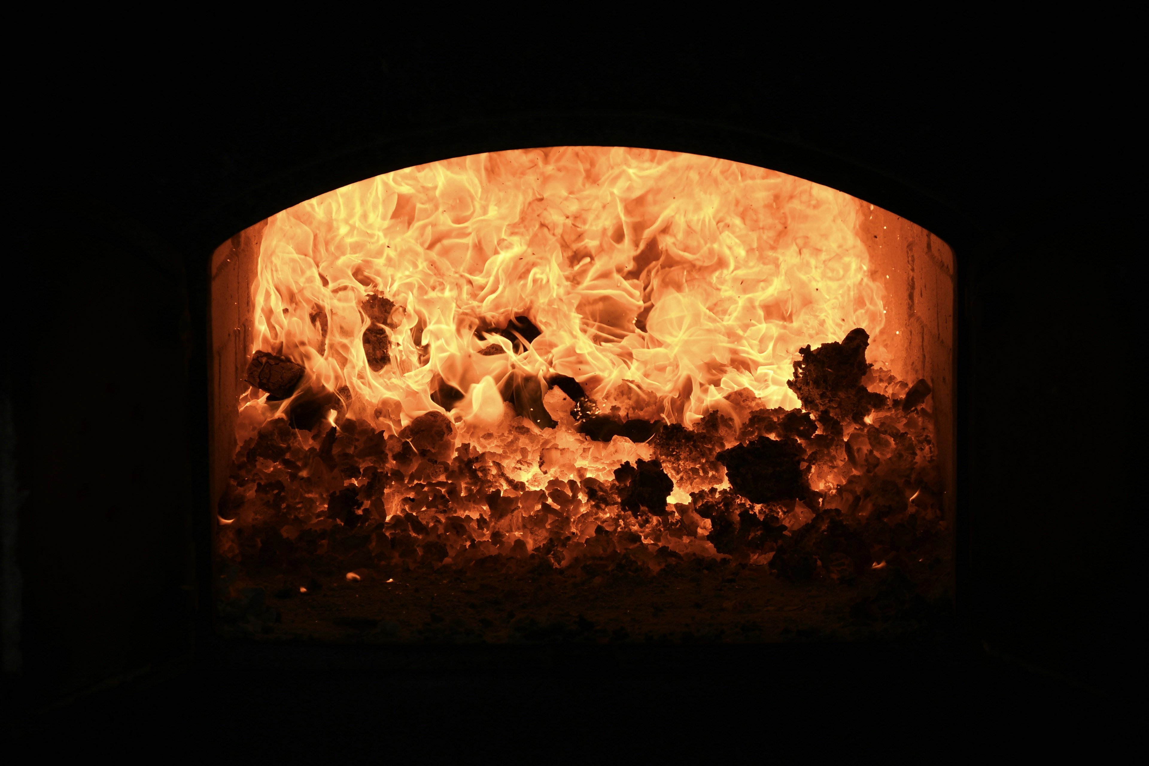 Interior view of a furnace with roaring flames