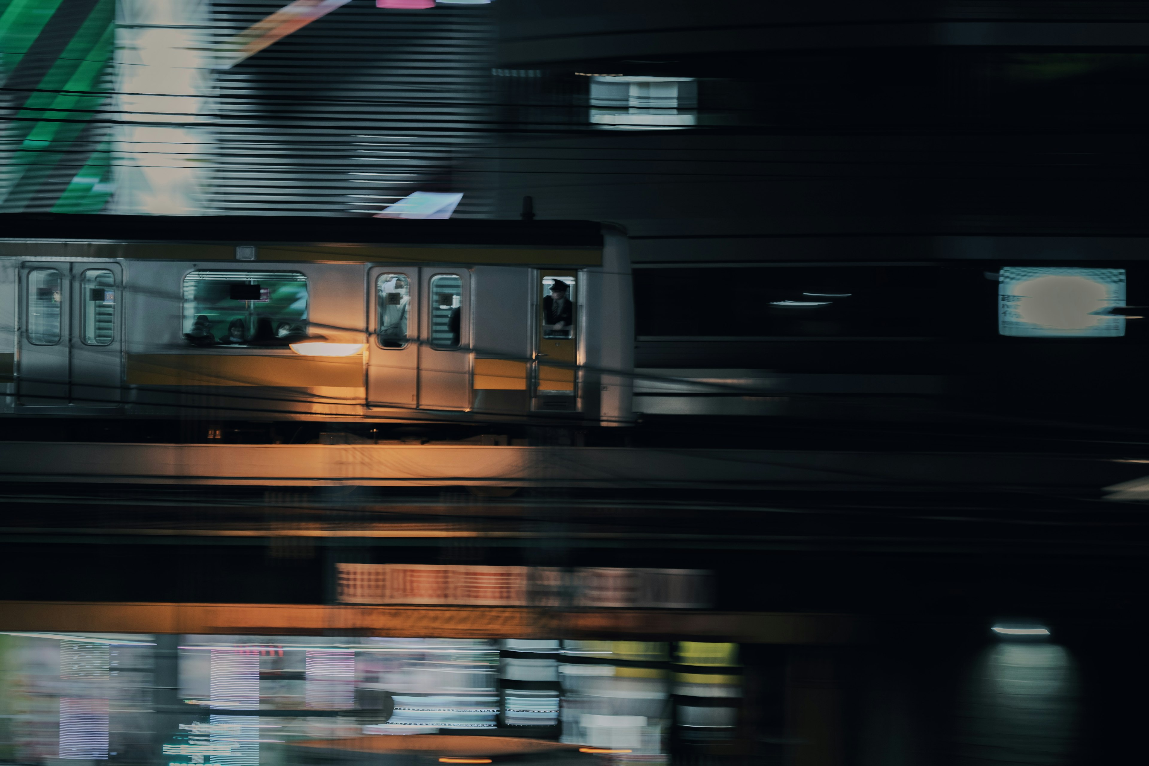 Moving train with blurred city lights in the background