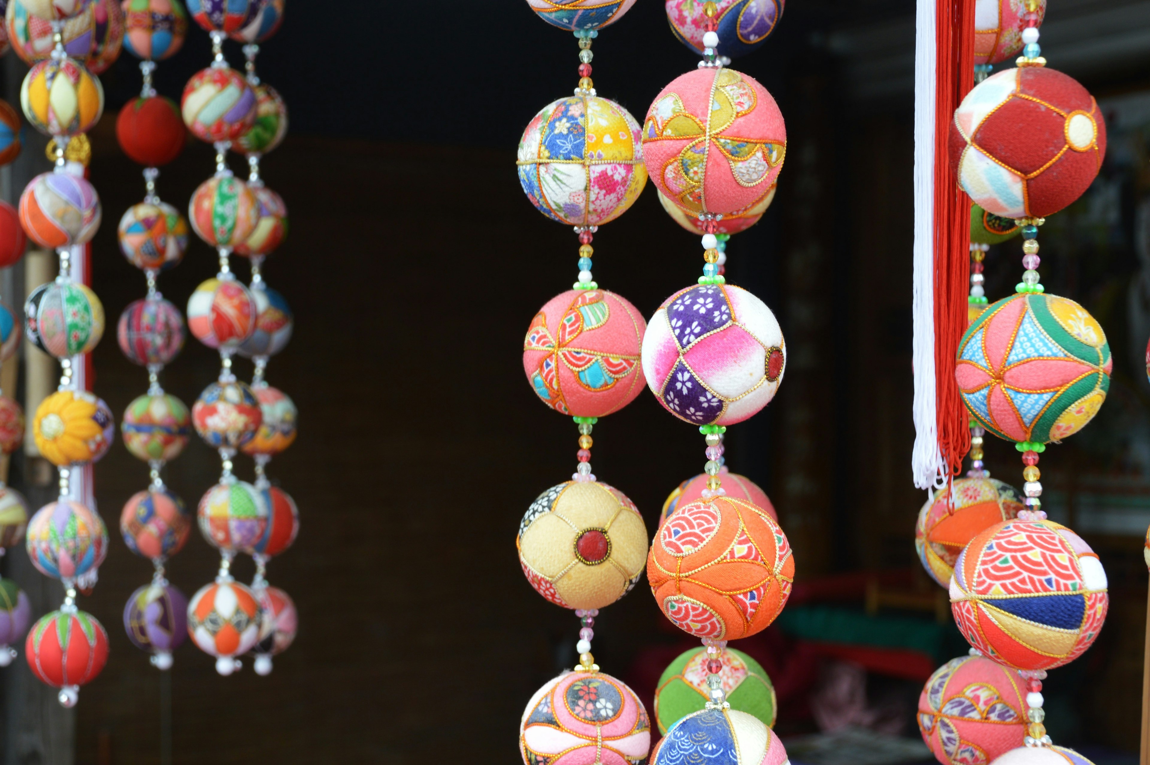 Colorful handmade decorative balls hanging in a row