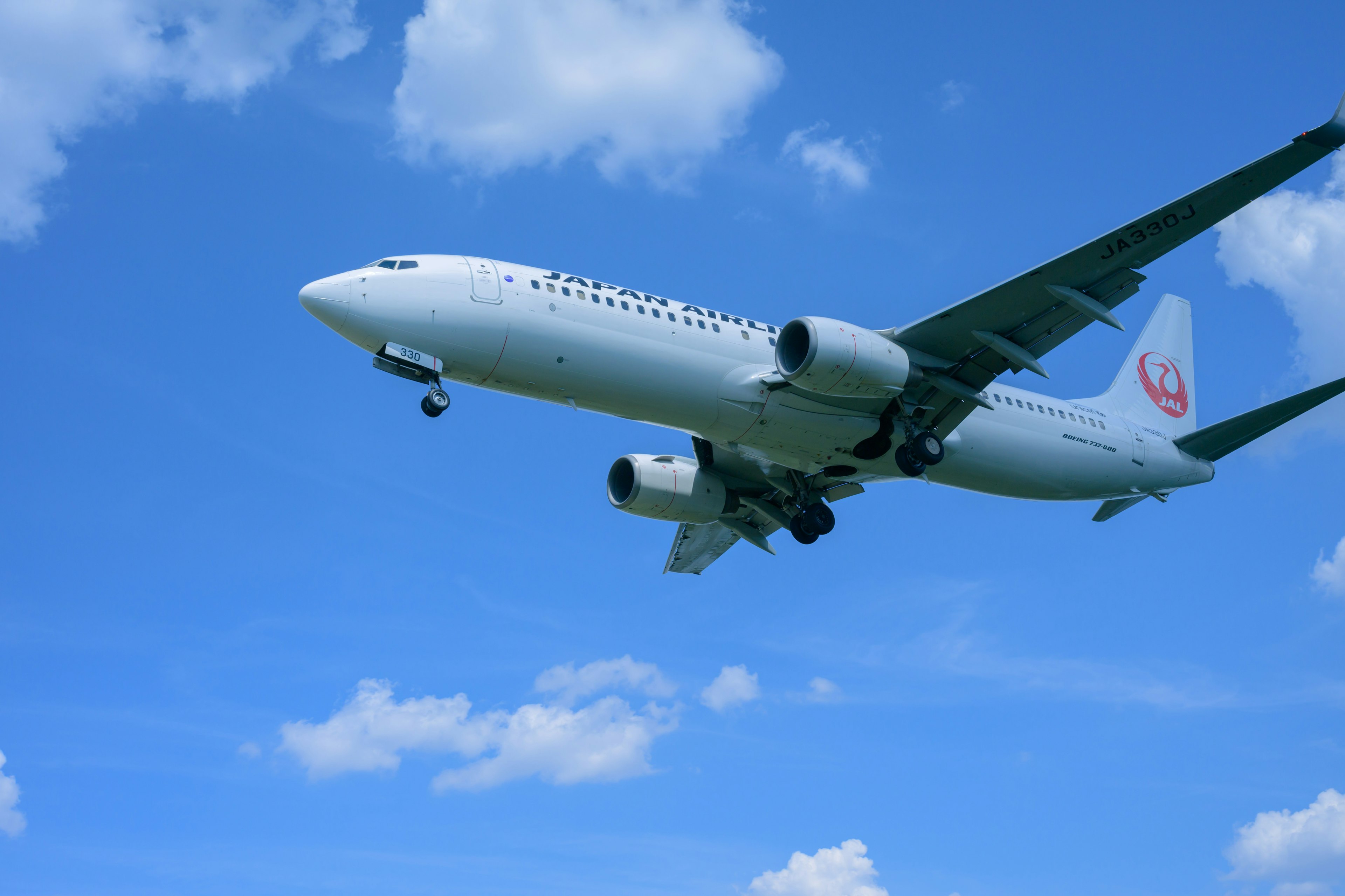 Airplane flying against a blue sky