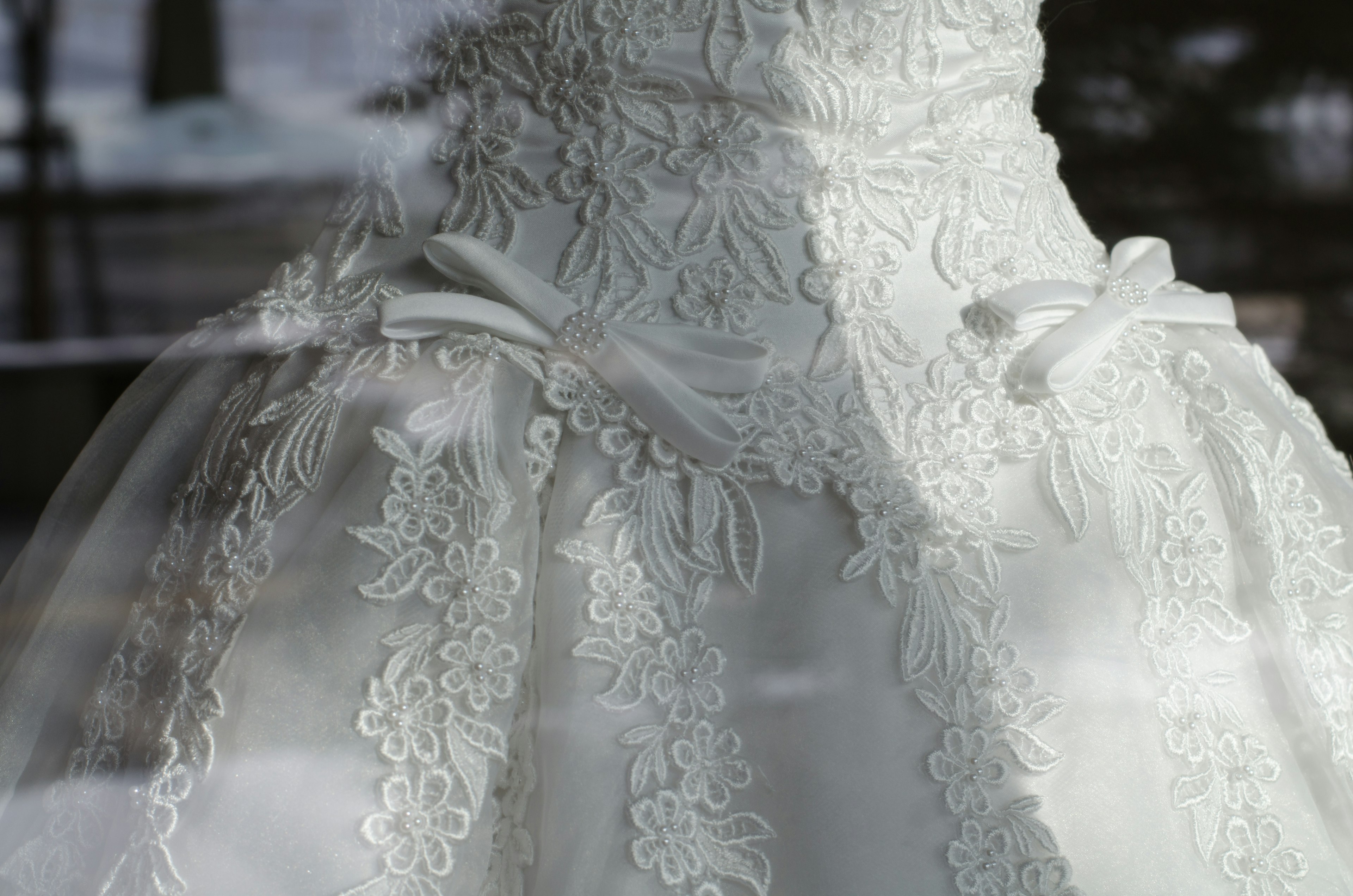 Detailed view of a beautiful white wedding dress