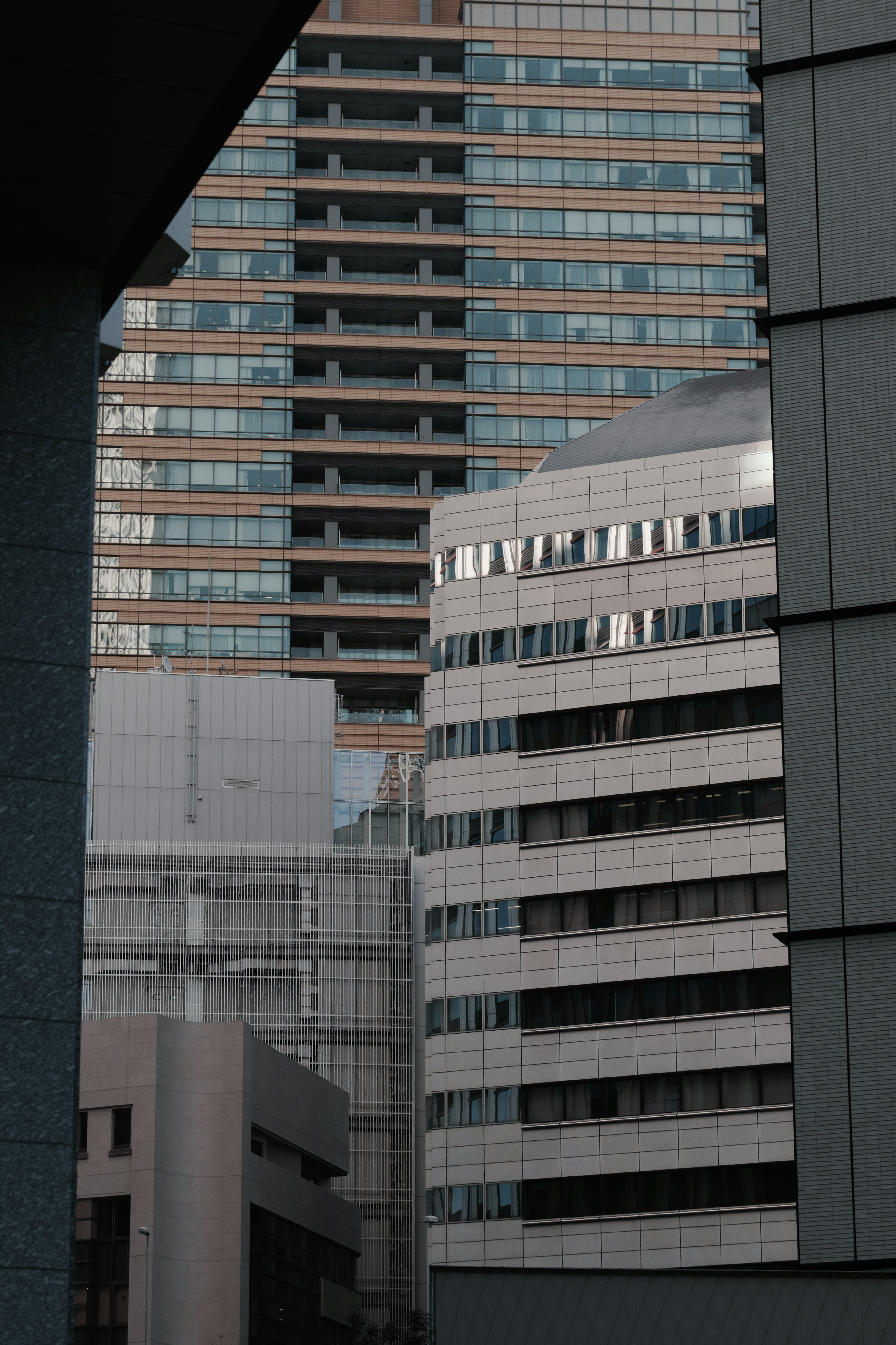 High-rise buildings with structural features and glass reflections