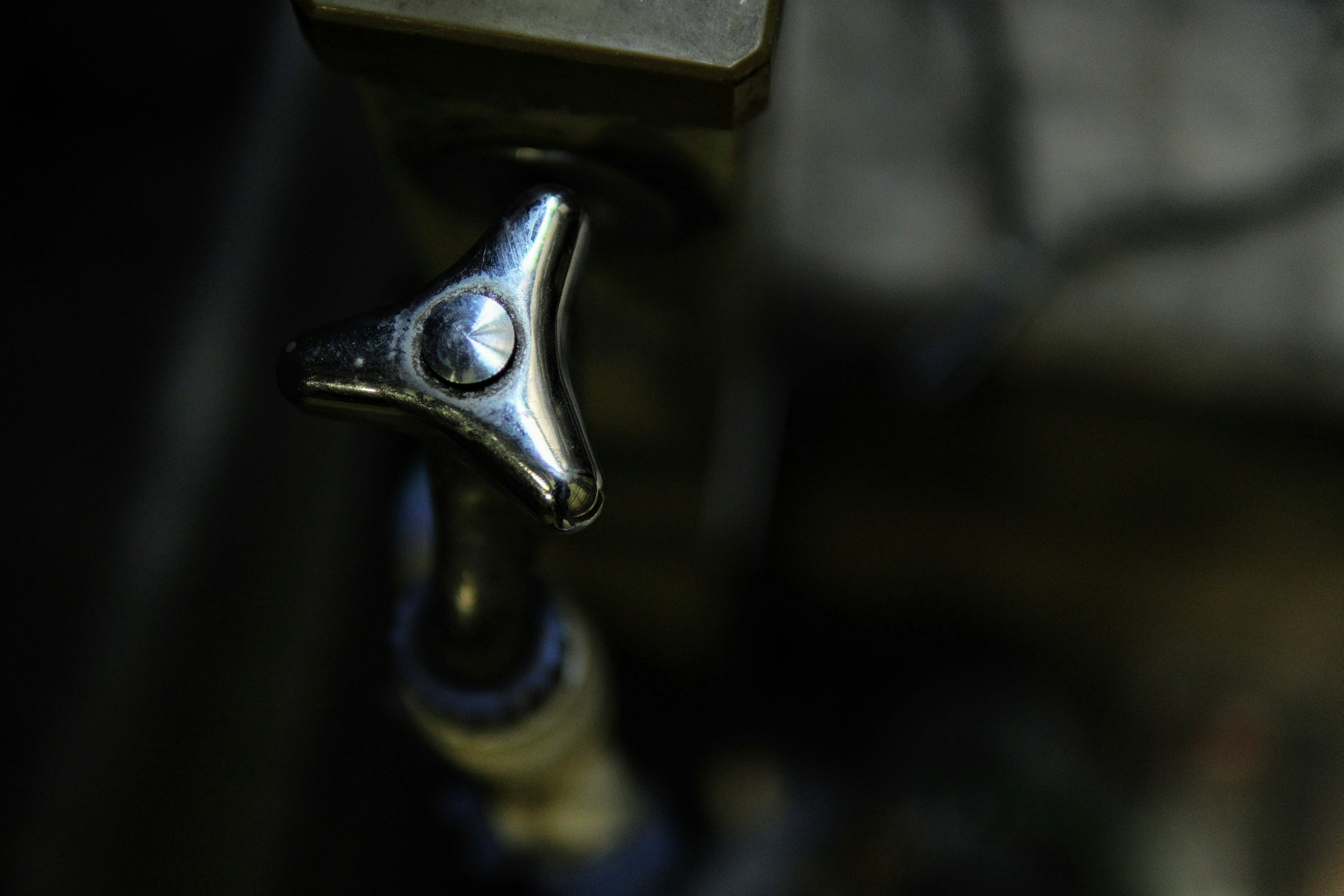 Close-up of a metal clamp part with a shiny finish