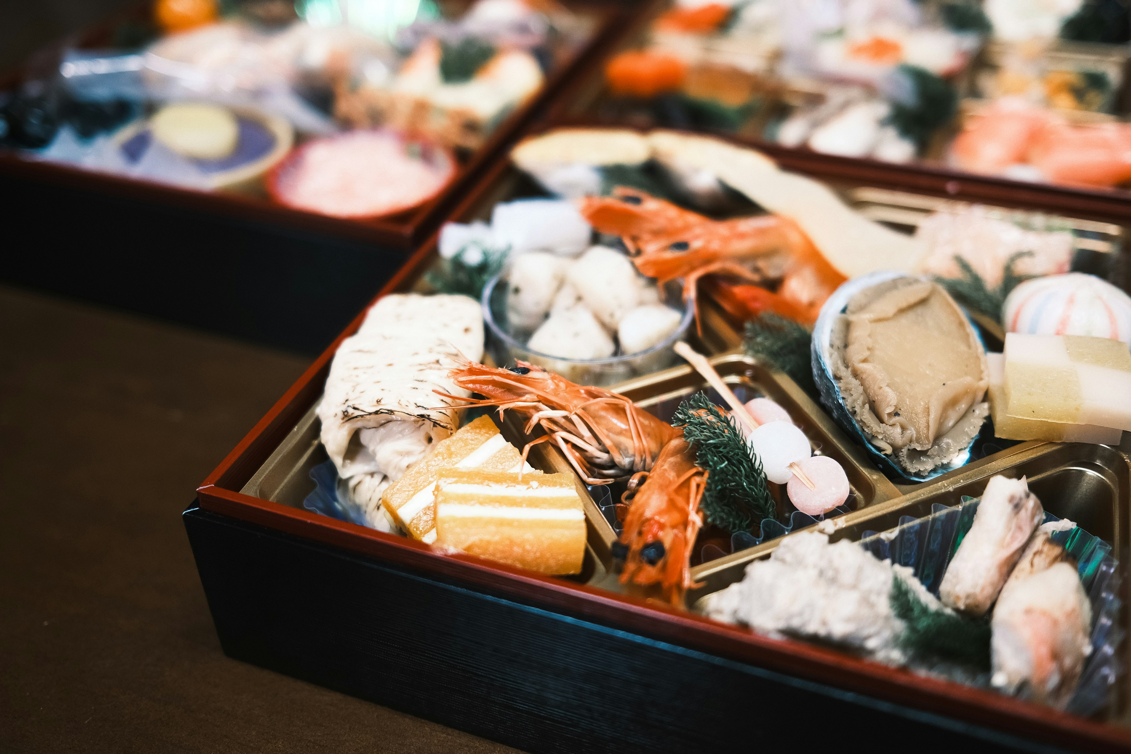 A beautiful assortment of sushi and seafood presented in a traditional Japanese style