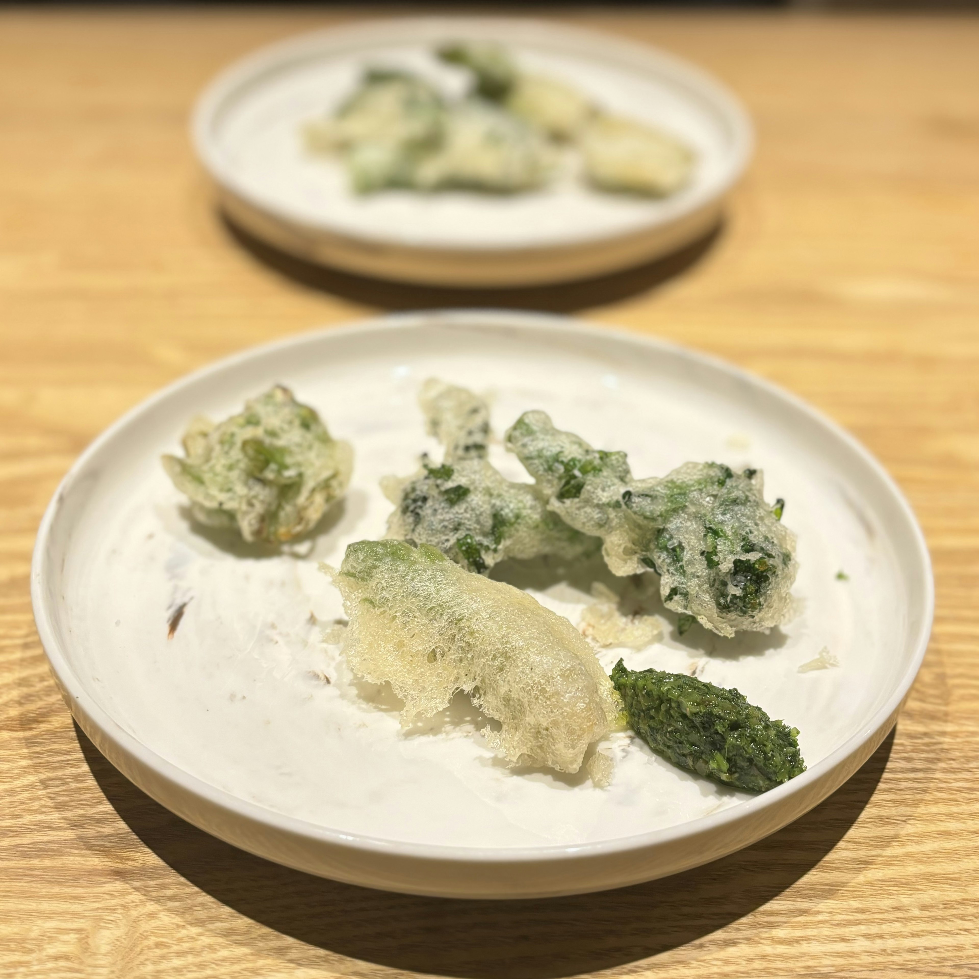 Assorted tempura served on a white plate