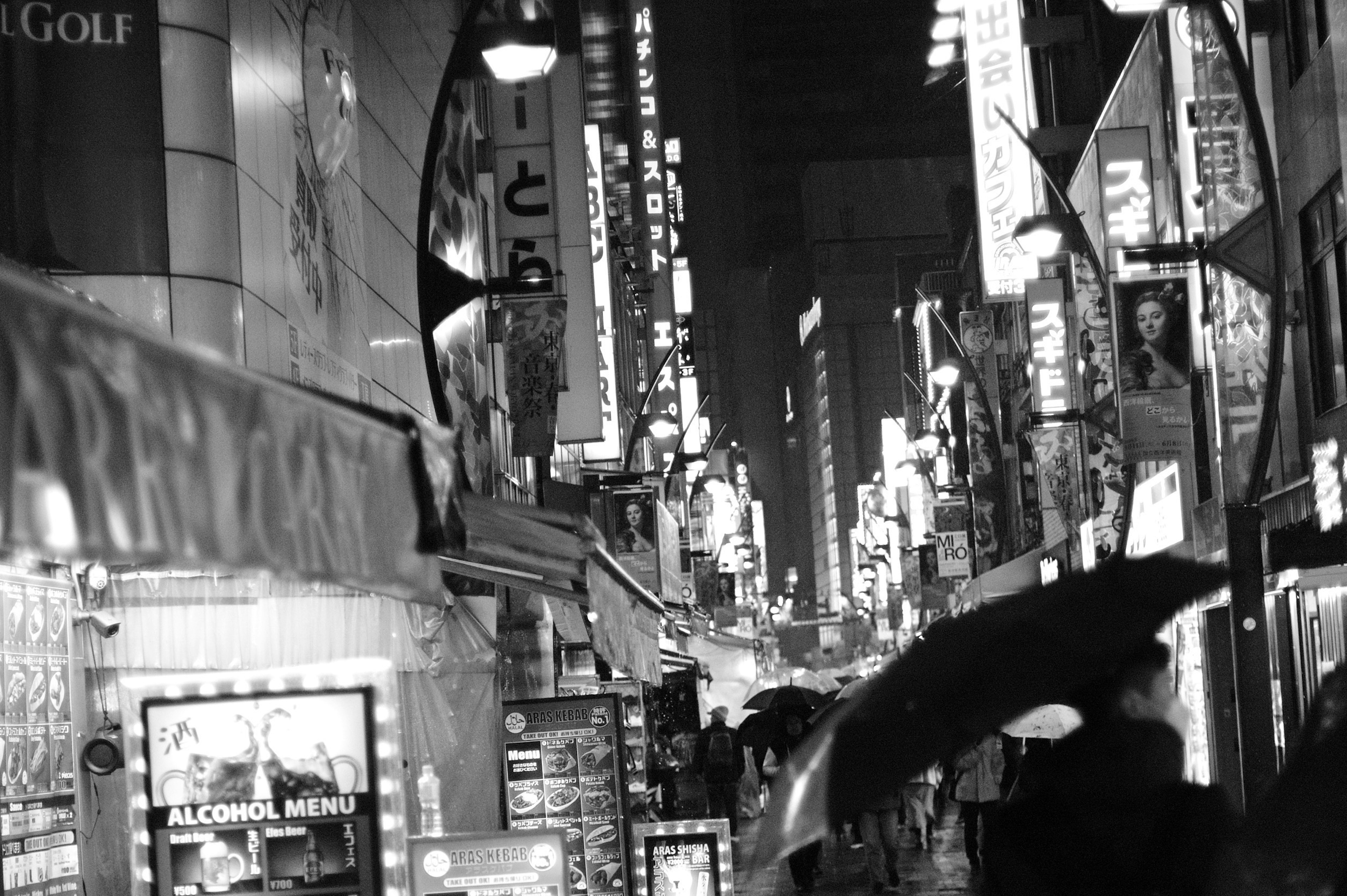 Night scene of a city street with neon signs