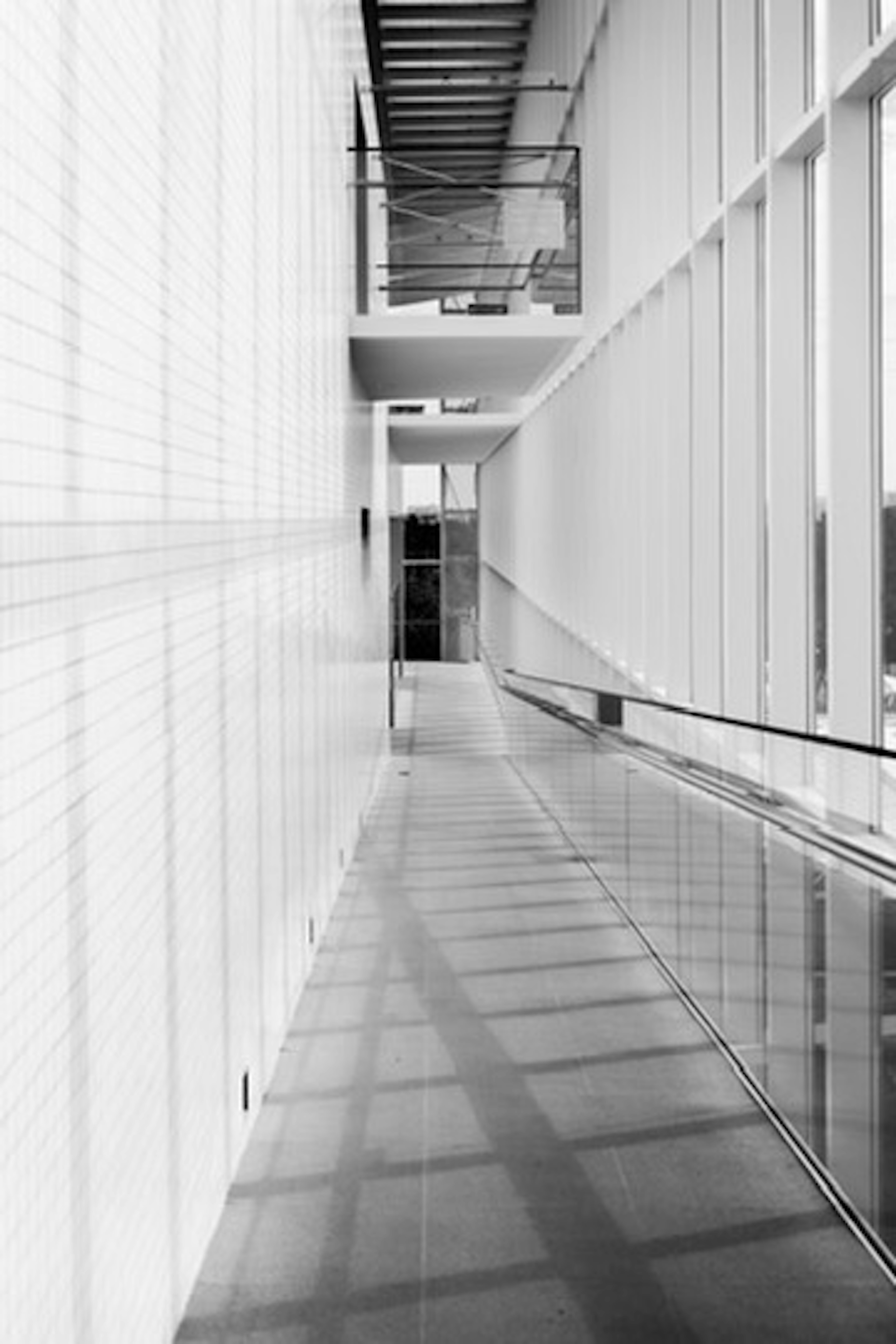 Modern interior hallway with linear design in black and white