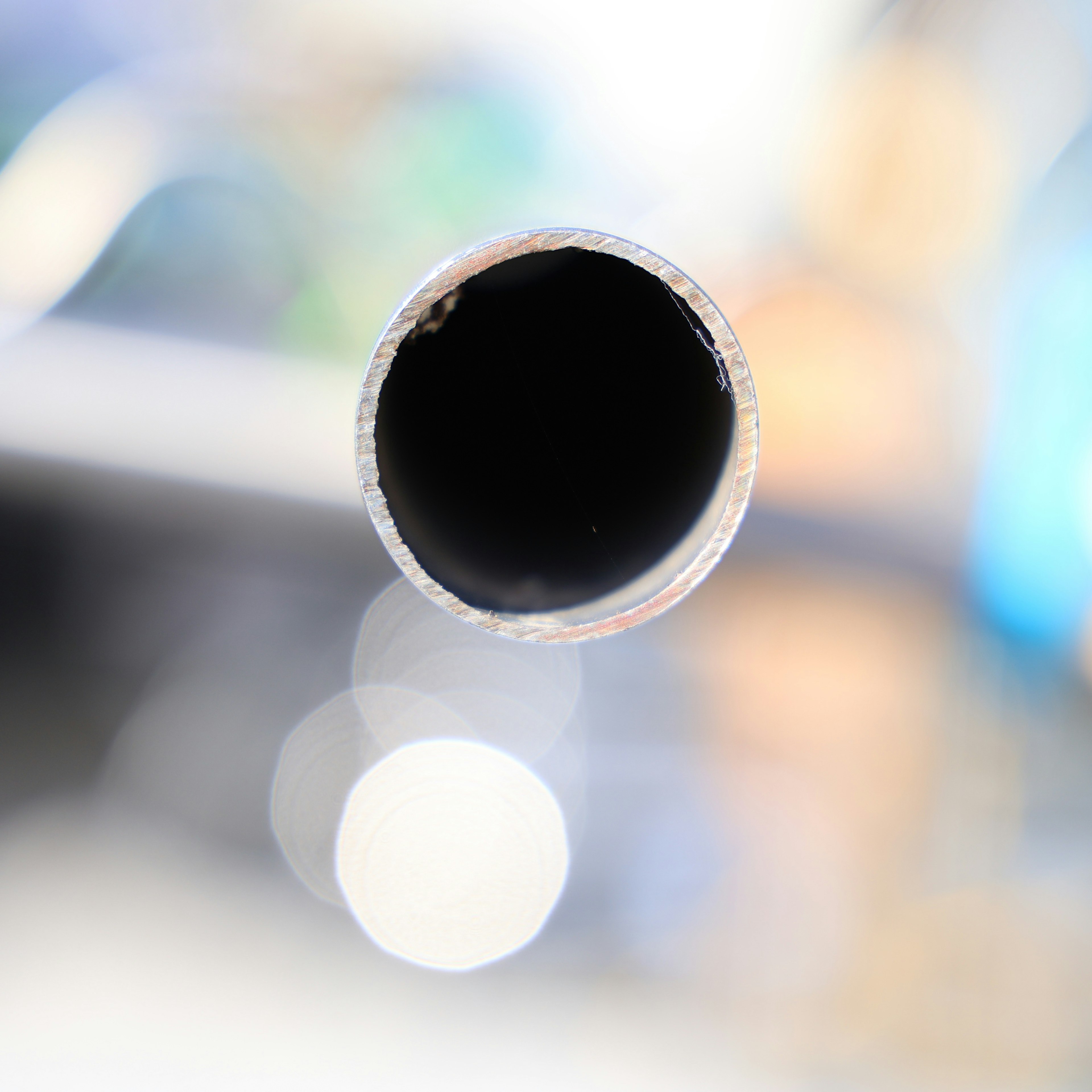 Image showing the end of a black tube with a blurred background