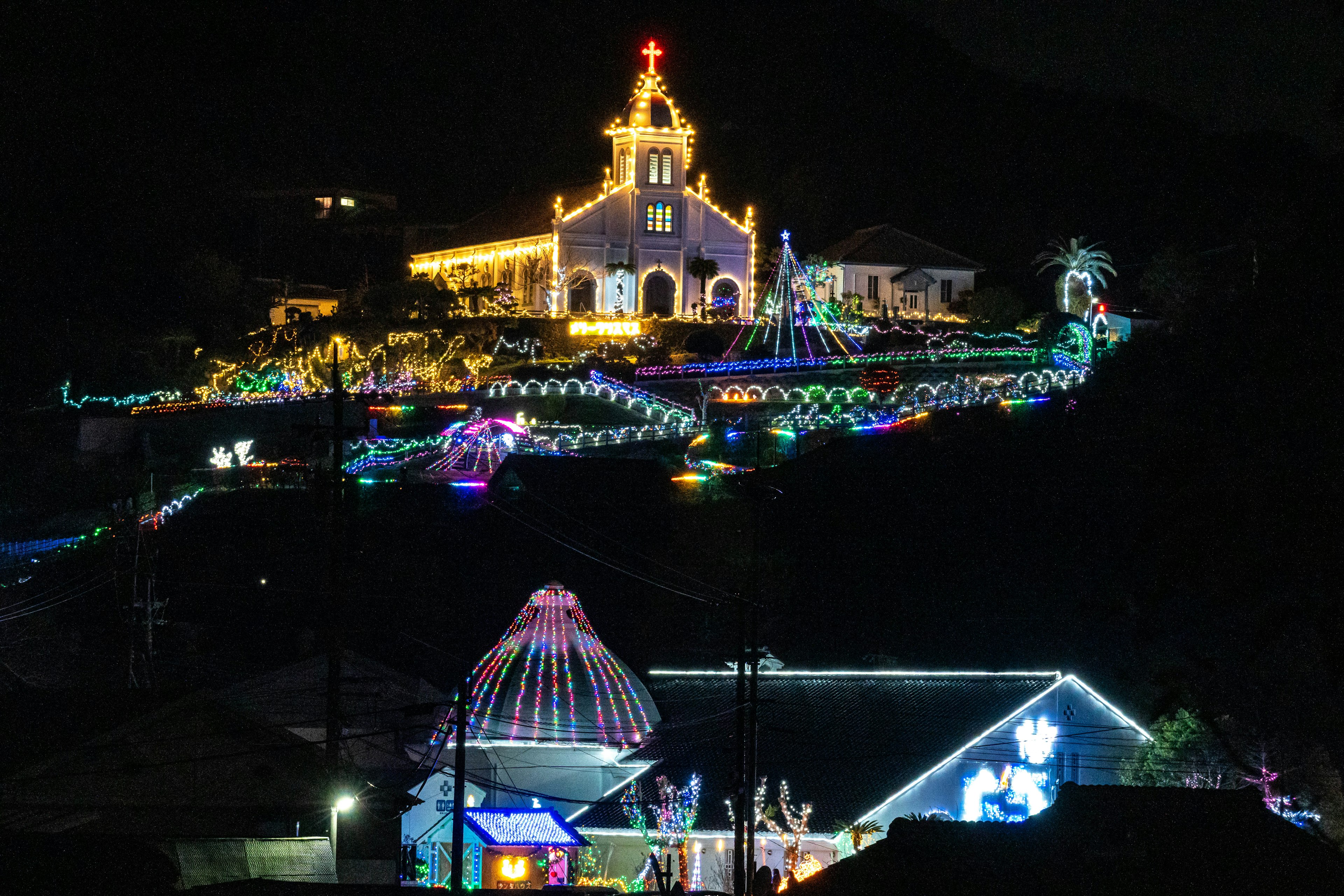 Colorful lights decorating a church at night