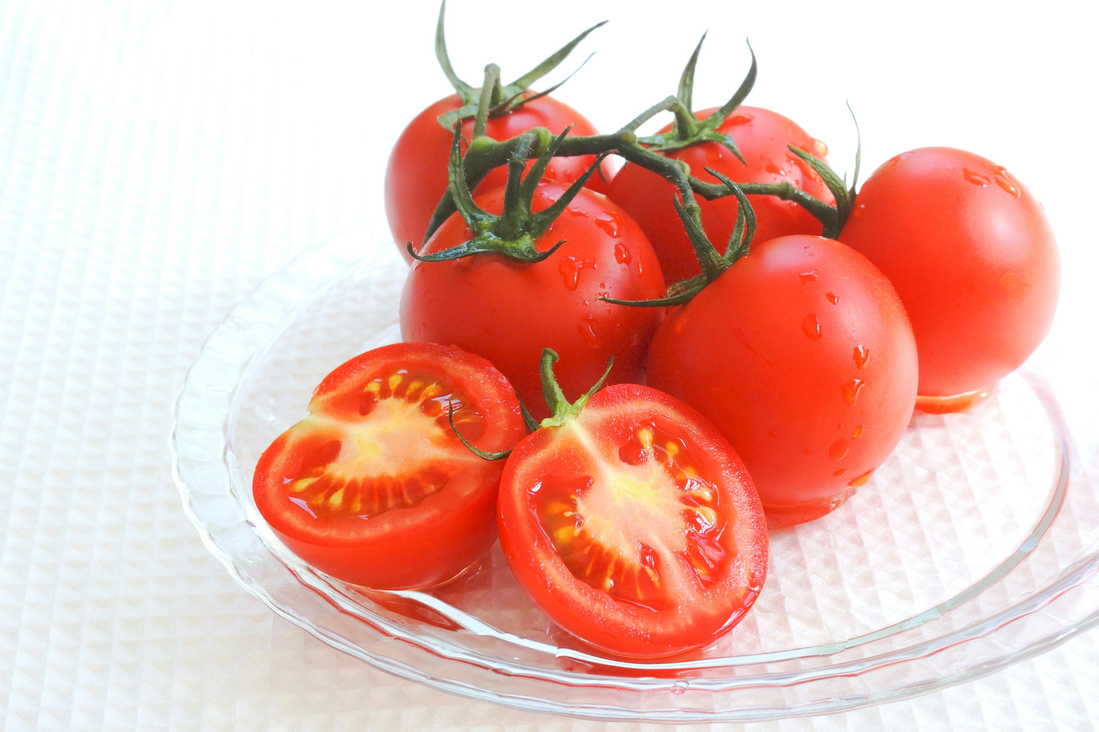 Fresh tomatoes arranged on a plate