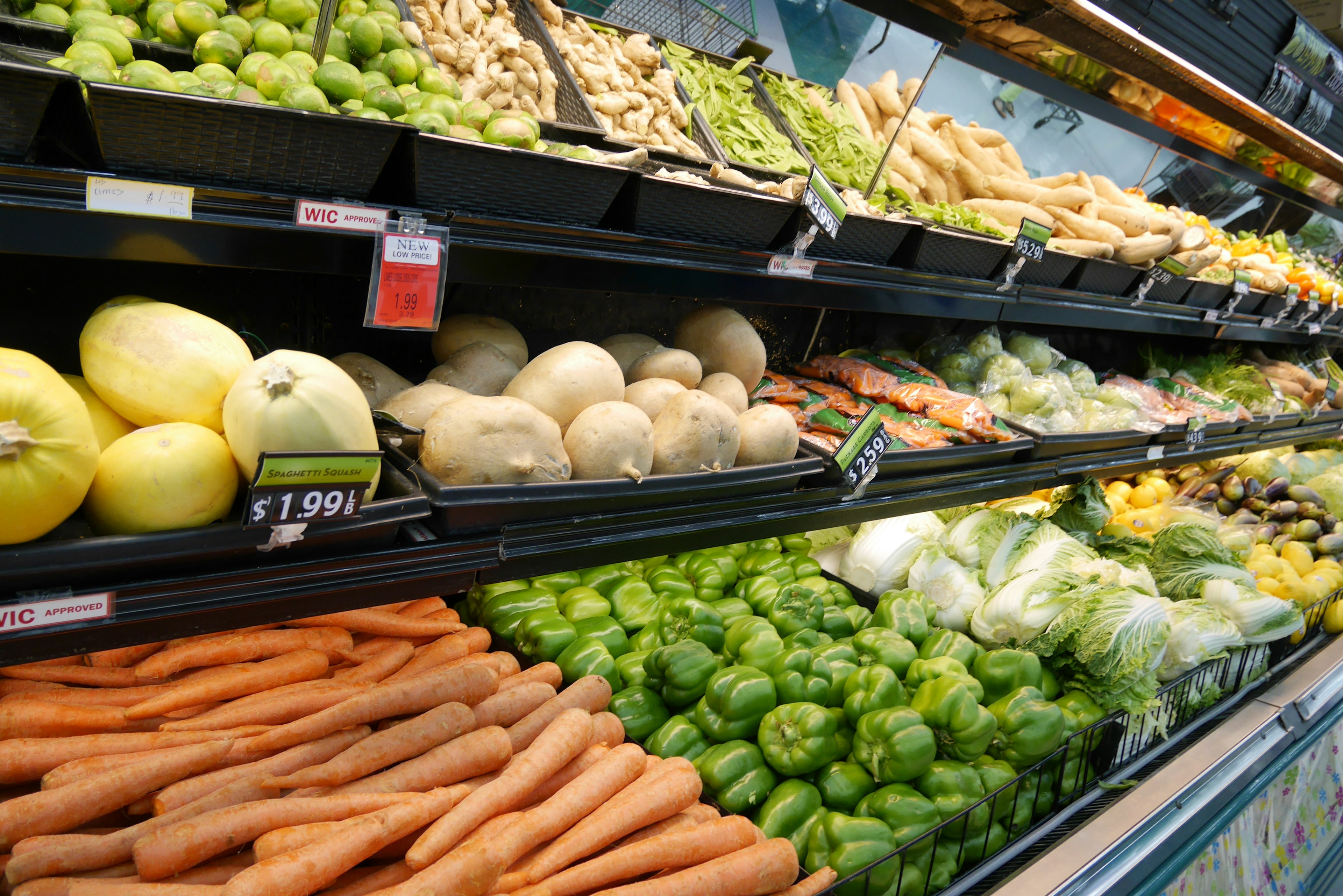 Colorful vegetables displayed in a supermarket produce section