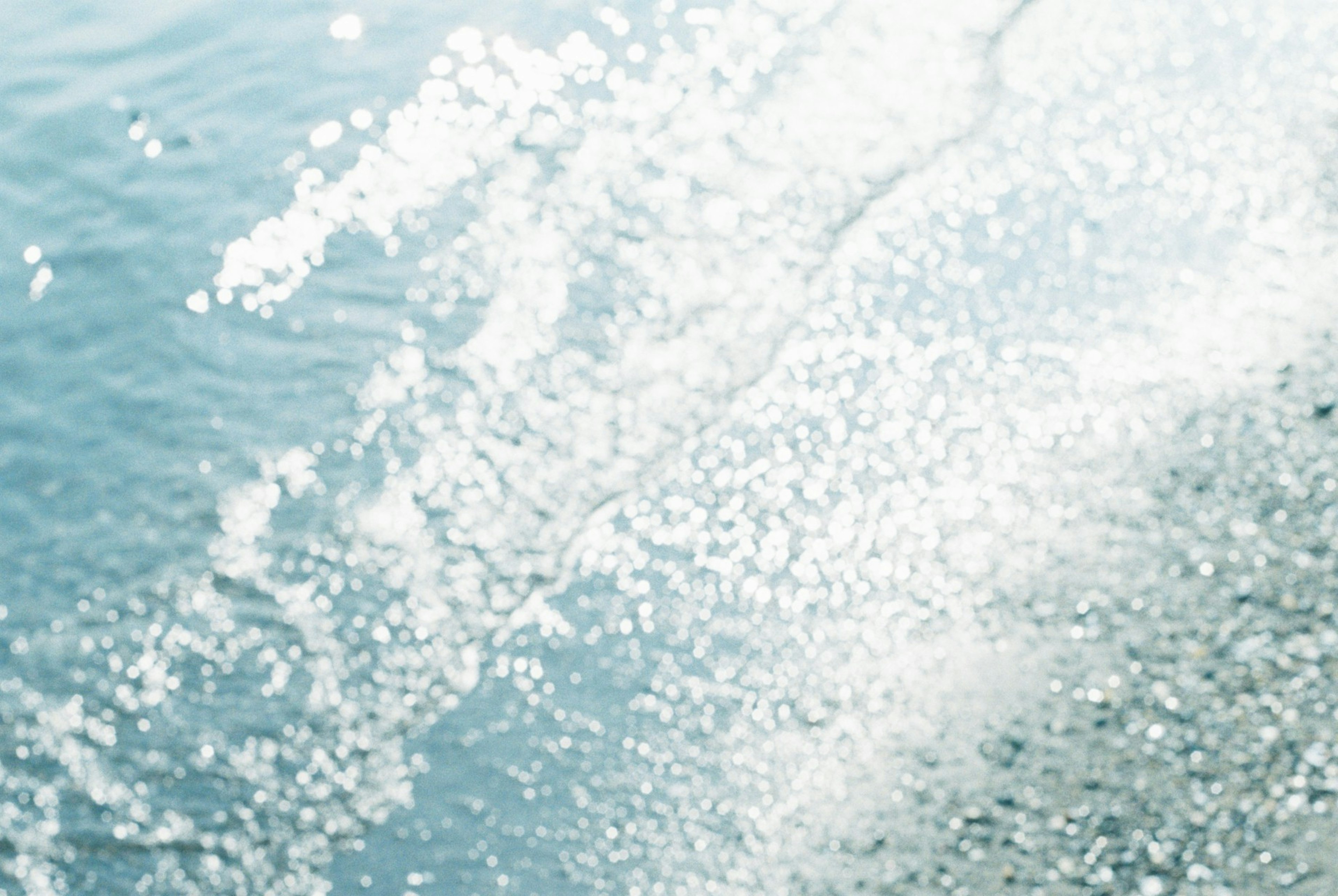 Rippling water surface with sparkling reflections