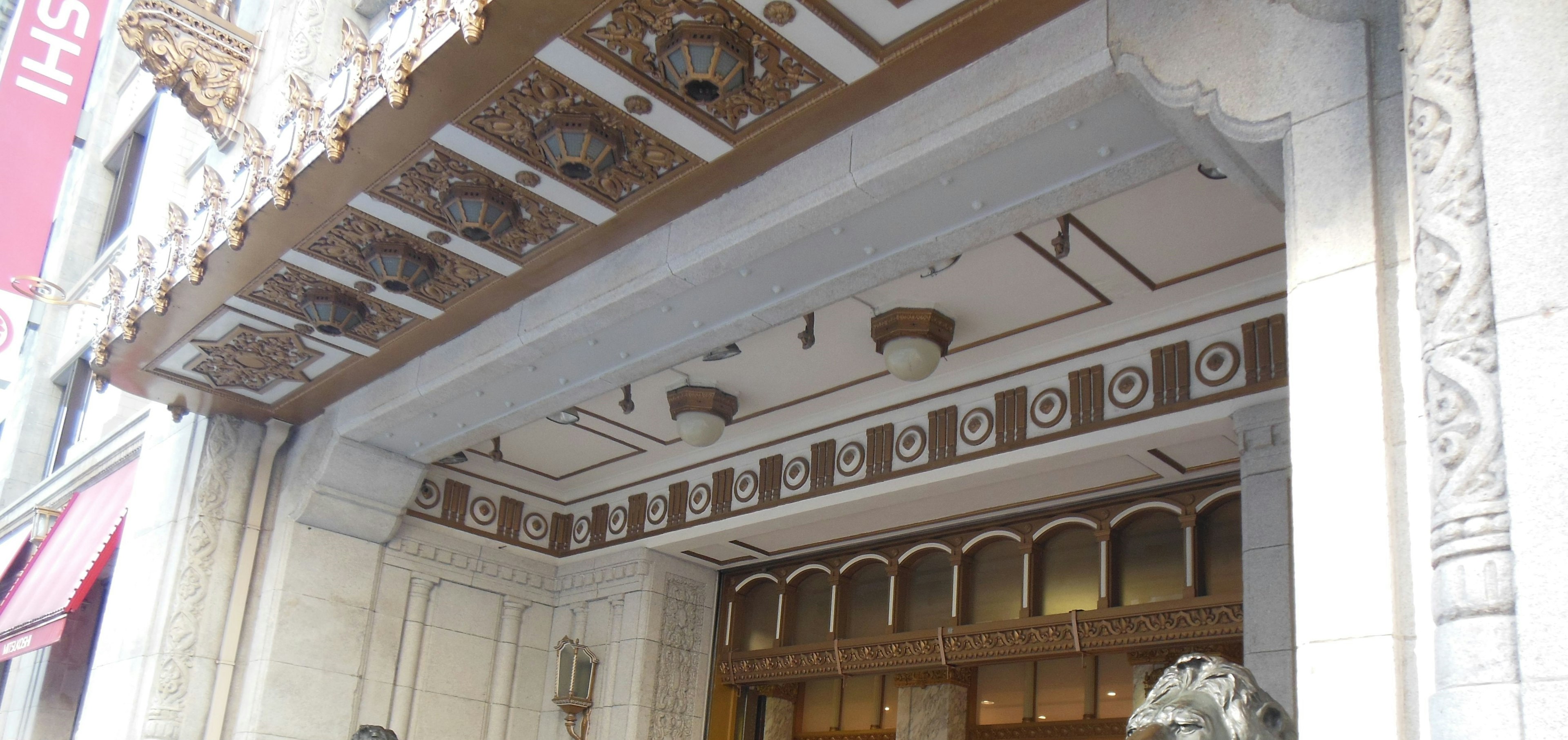 Historic building entrance with decorative facade and arched windows