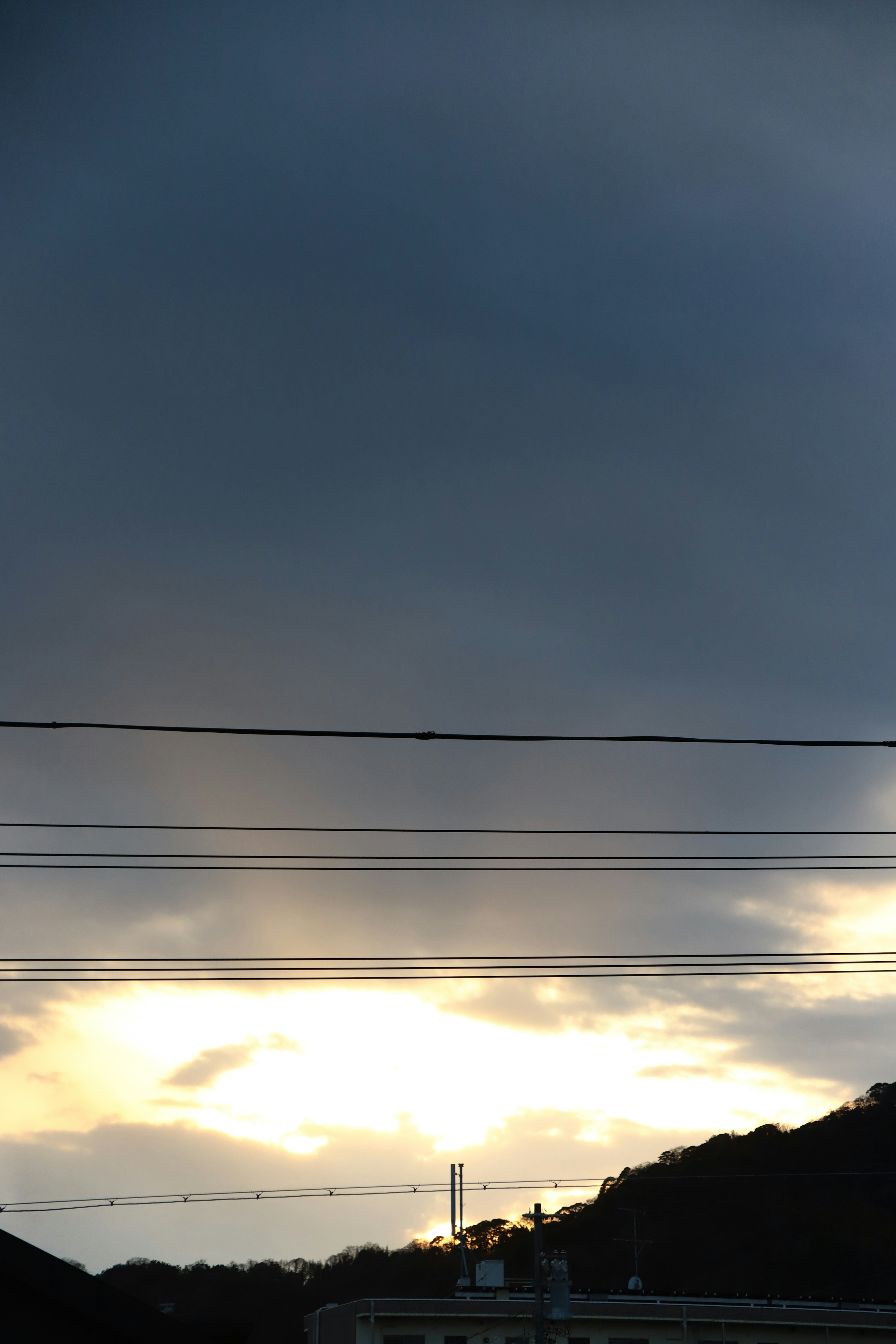 A landscape with sunlight breaking through dark clouds