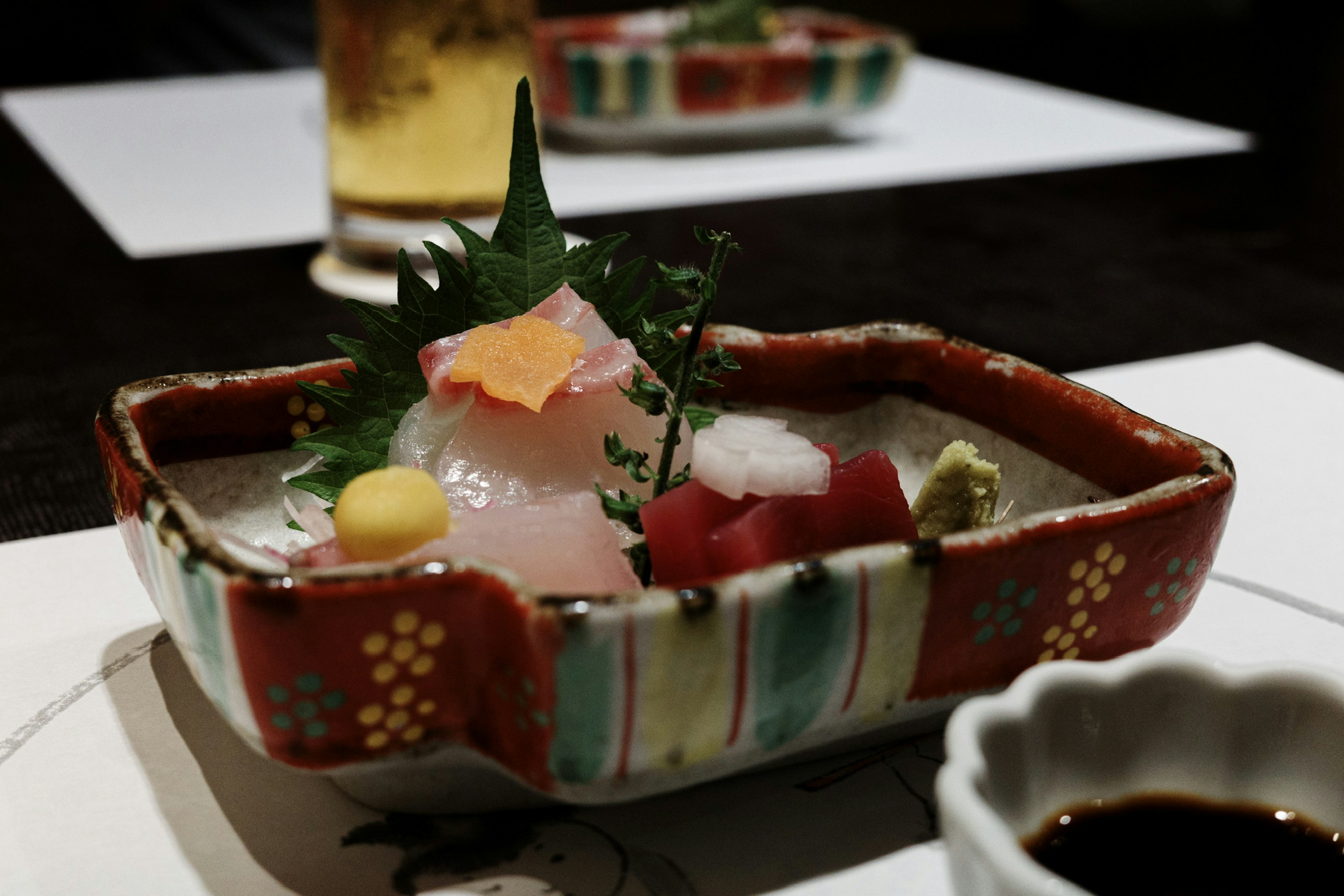 Colorful sashimi presented in a beautiful traditional Japanese dish