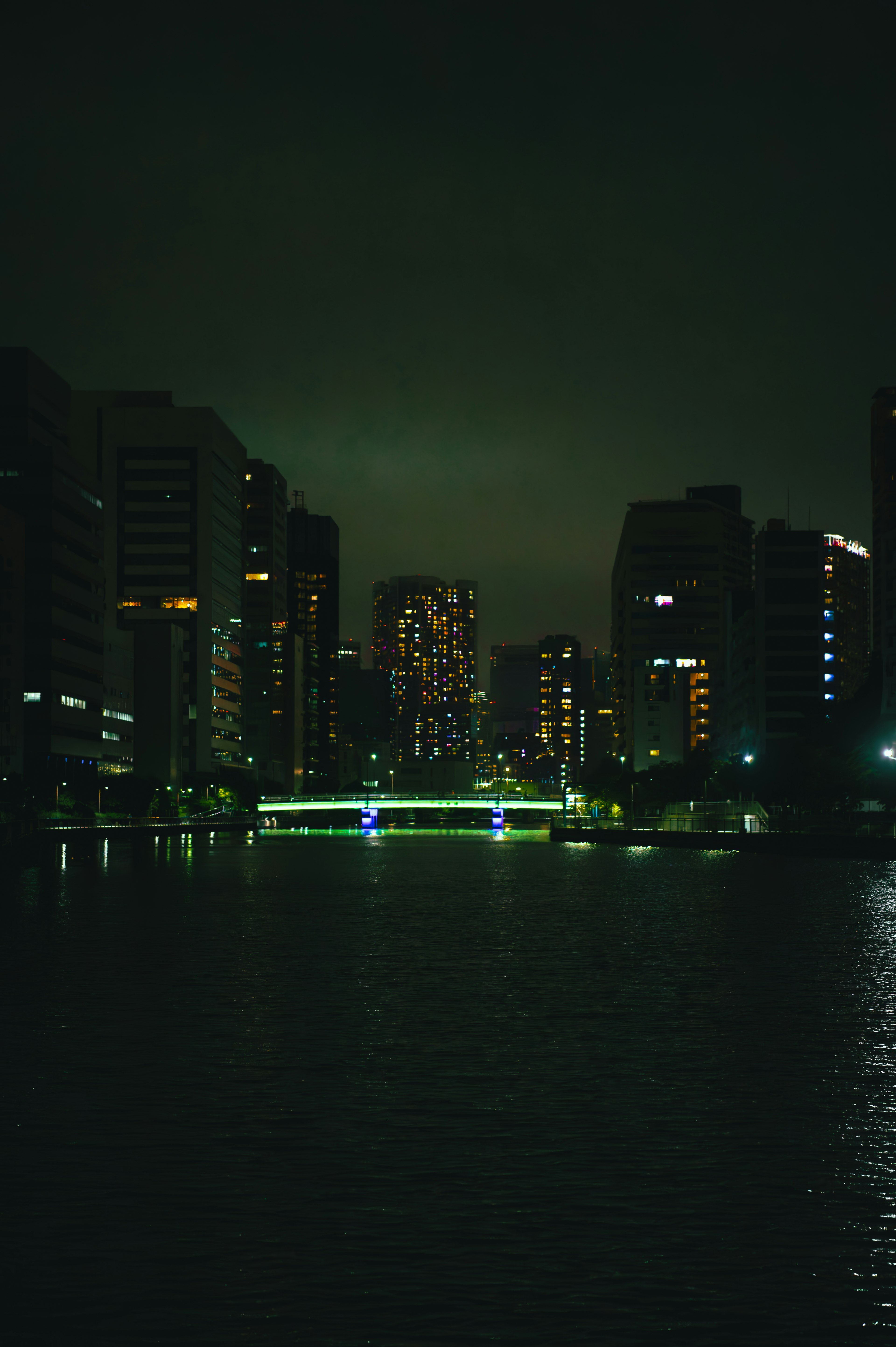 Dark urban landscape with reflections on water