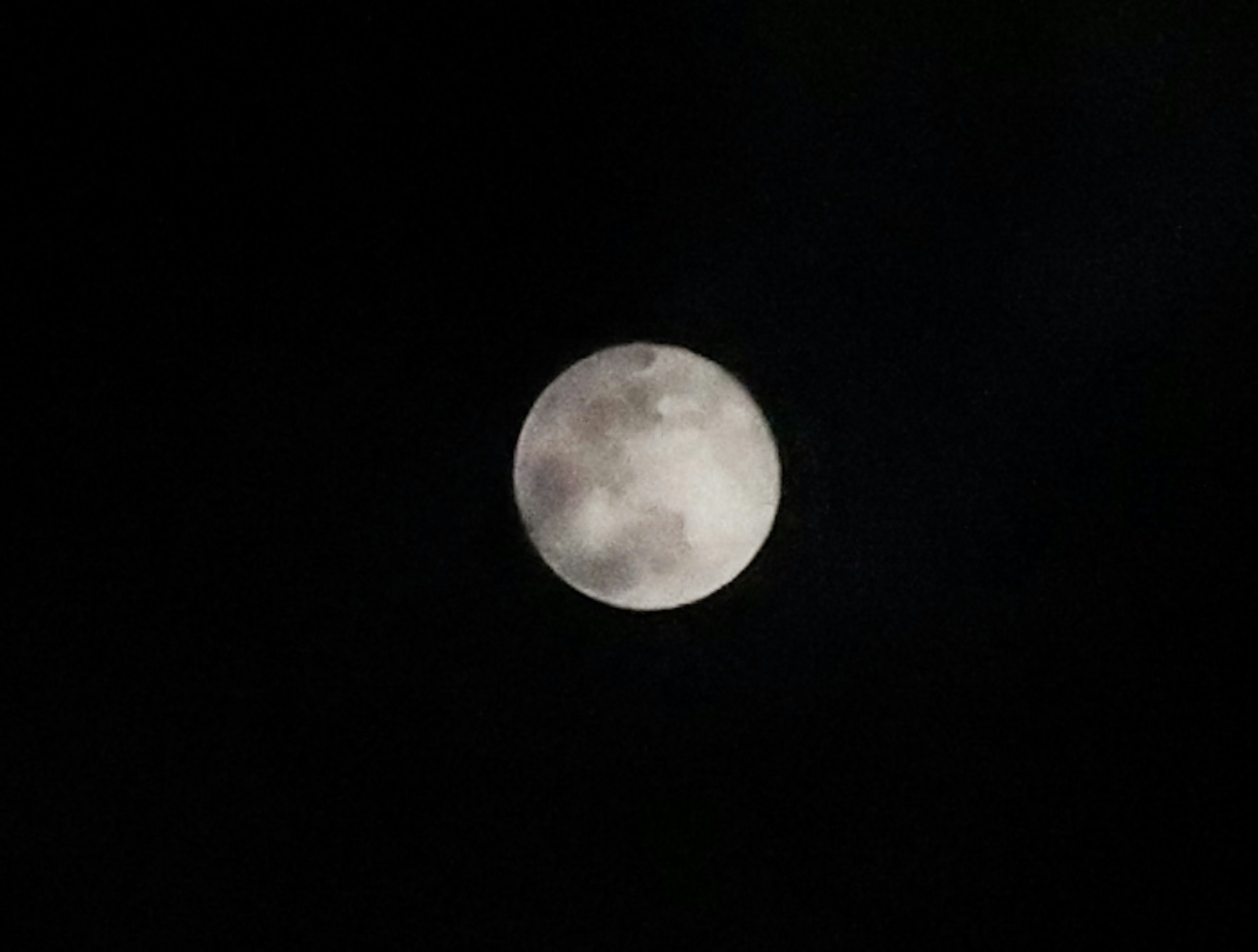 Bright full moon in the night sky