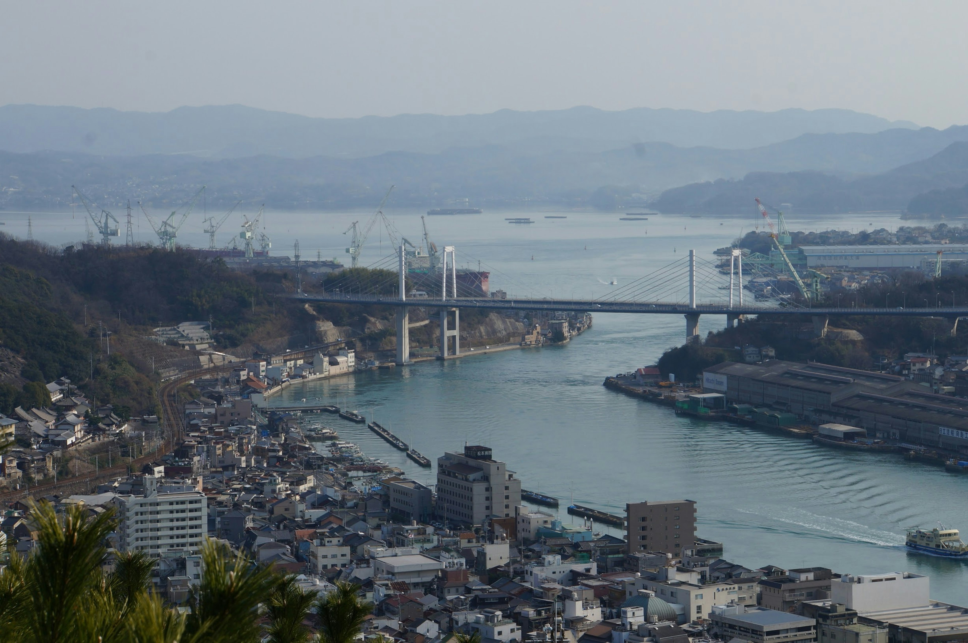 Urban landscape with a river and bridges in the background