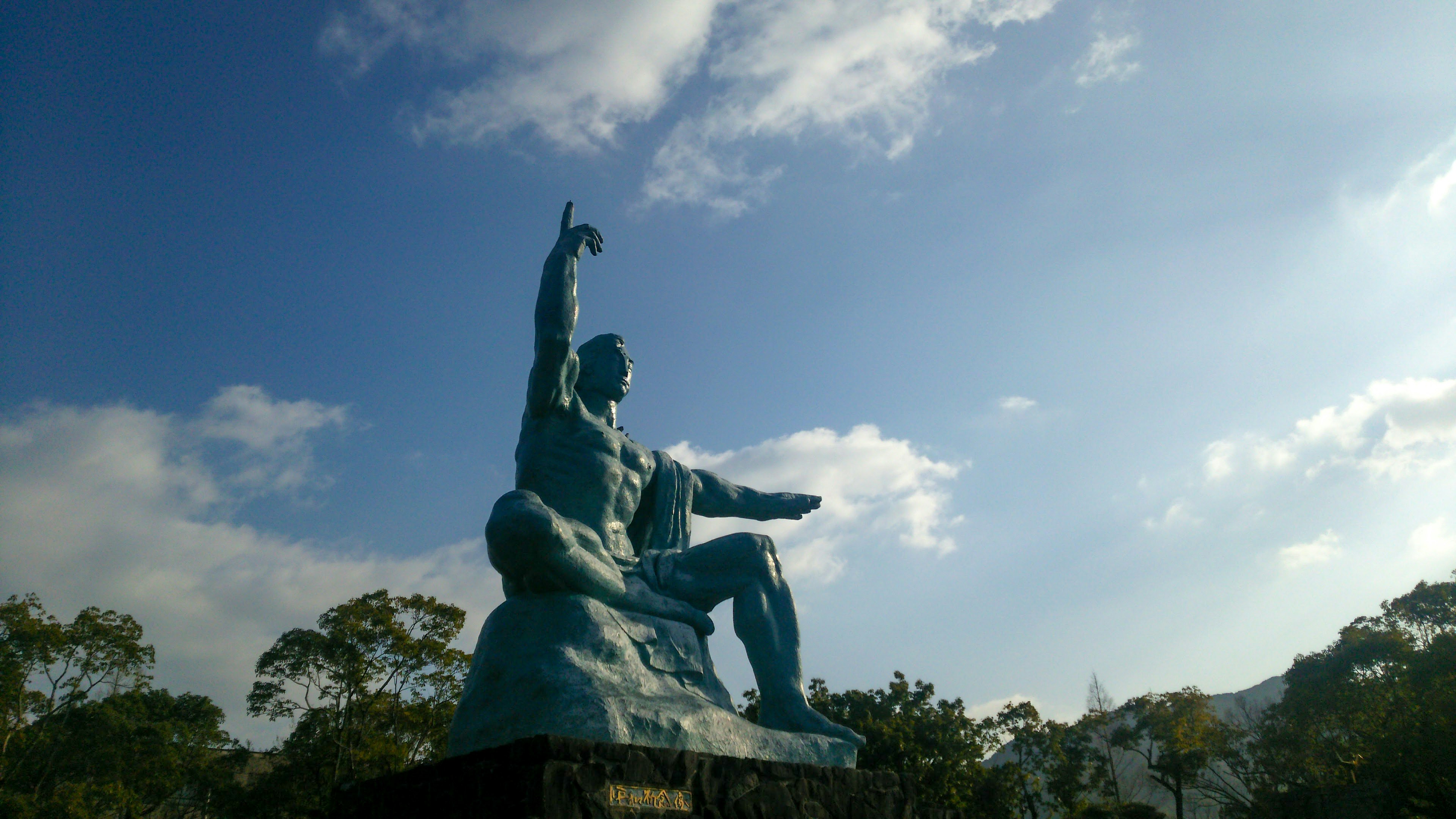 Bronze statue pointing towards the sky