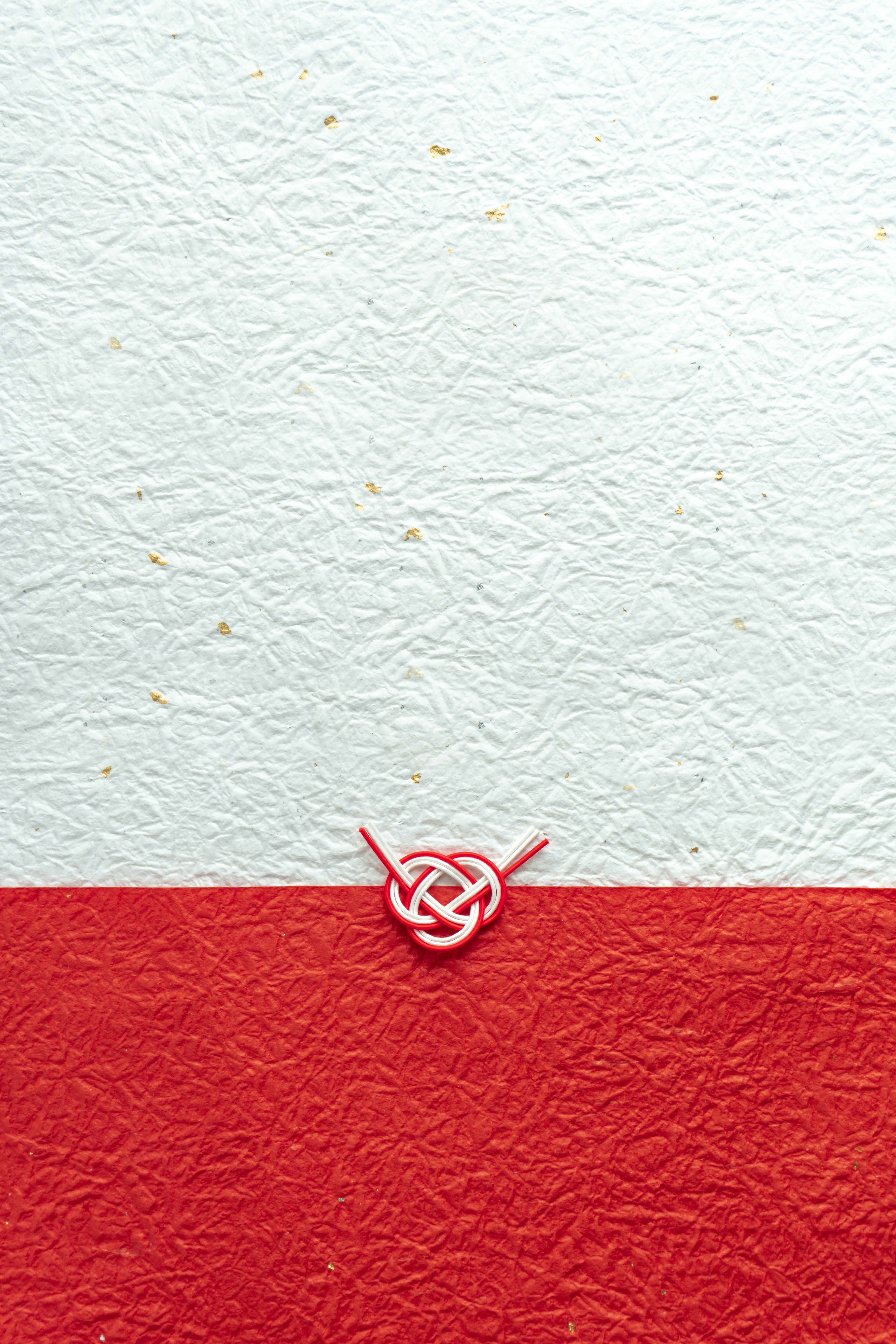 Red and white background with a decorative knot