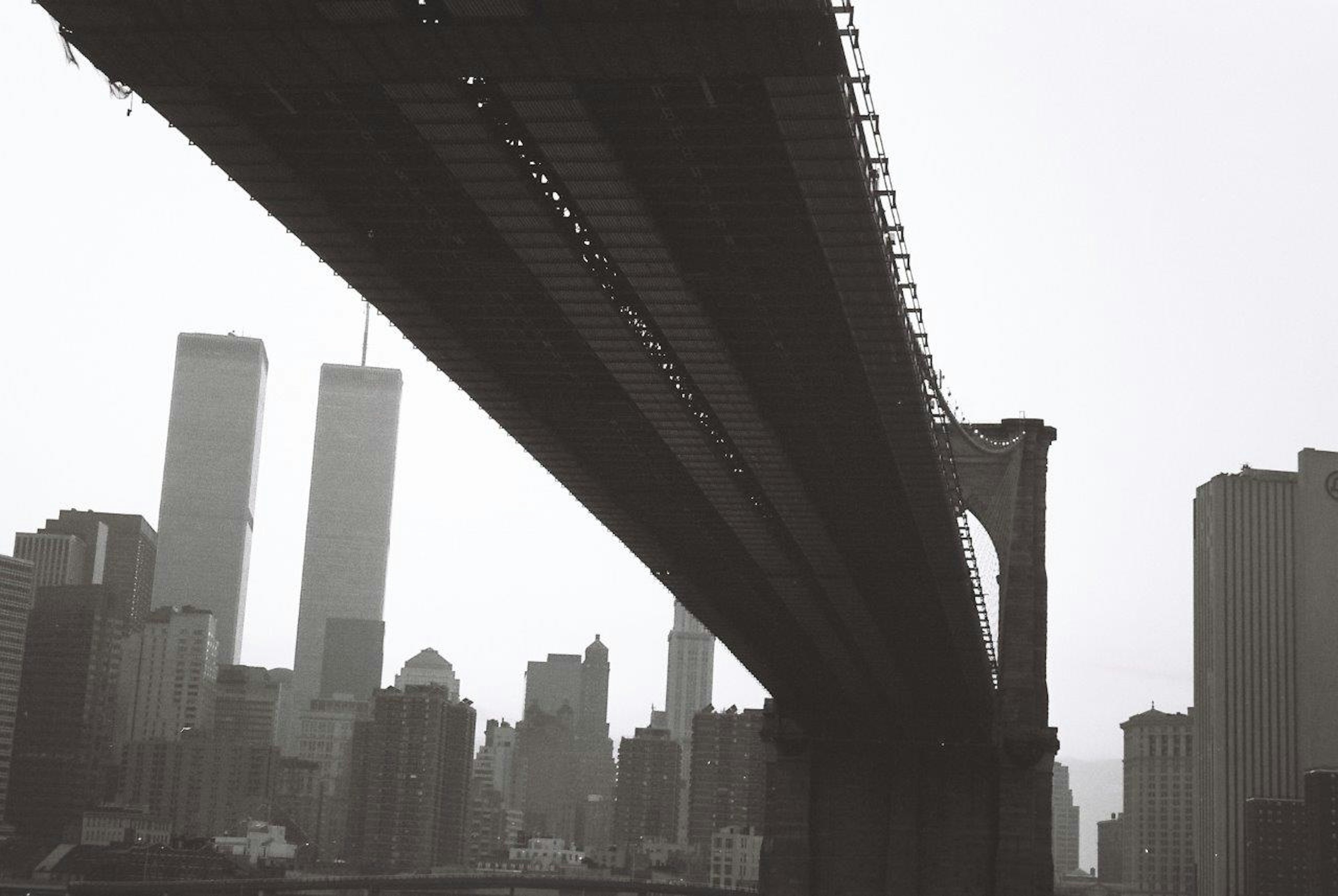 Silhouette of Brooklyn Bridge with Twin Towers in monochrome landscape