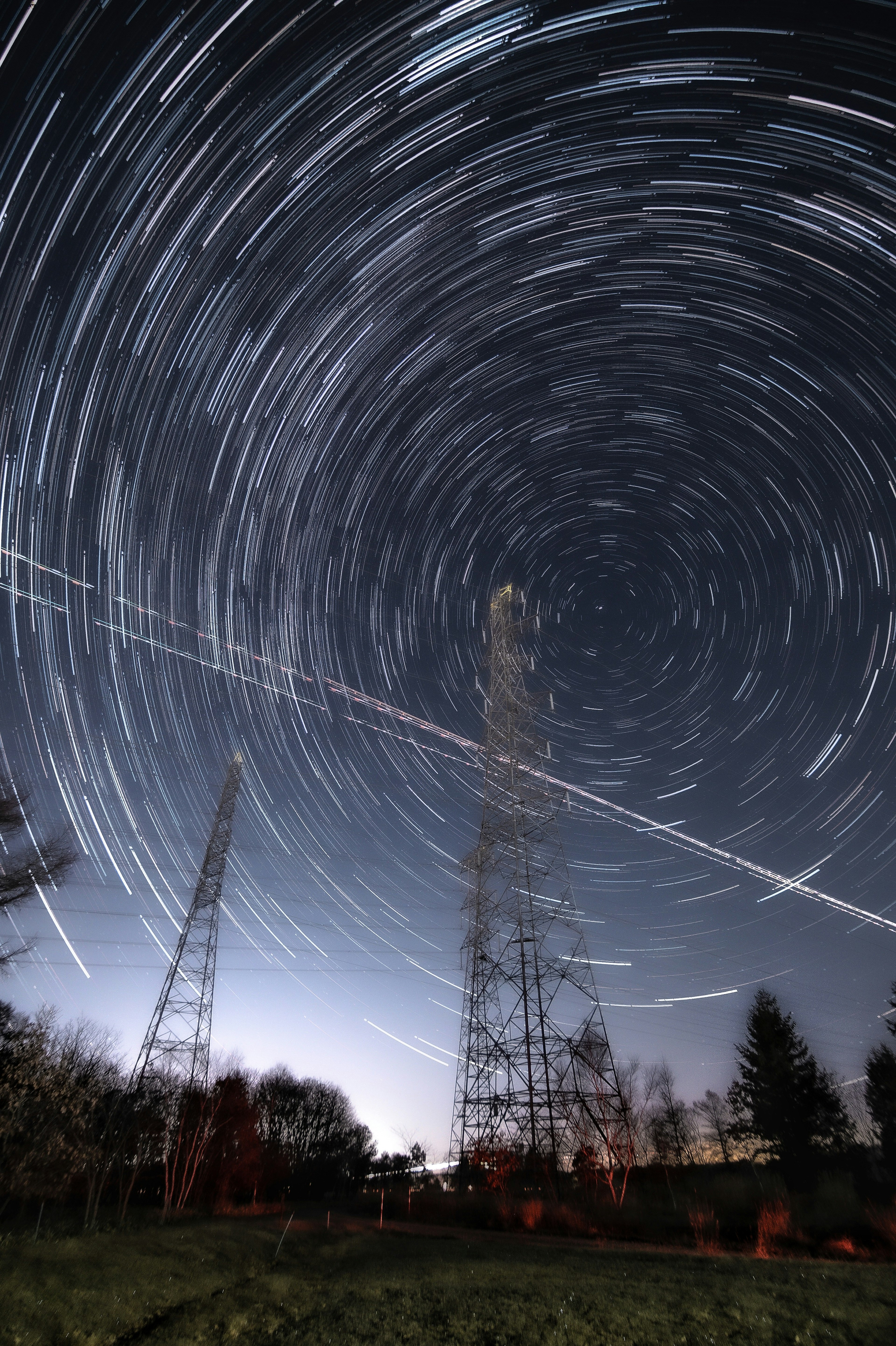 Long exposure photo of star trails and radio towers