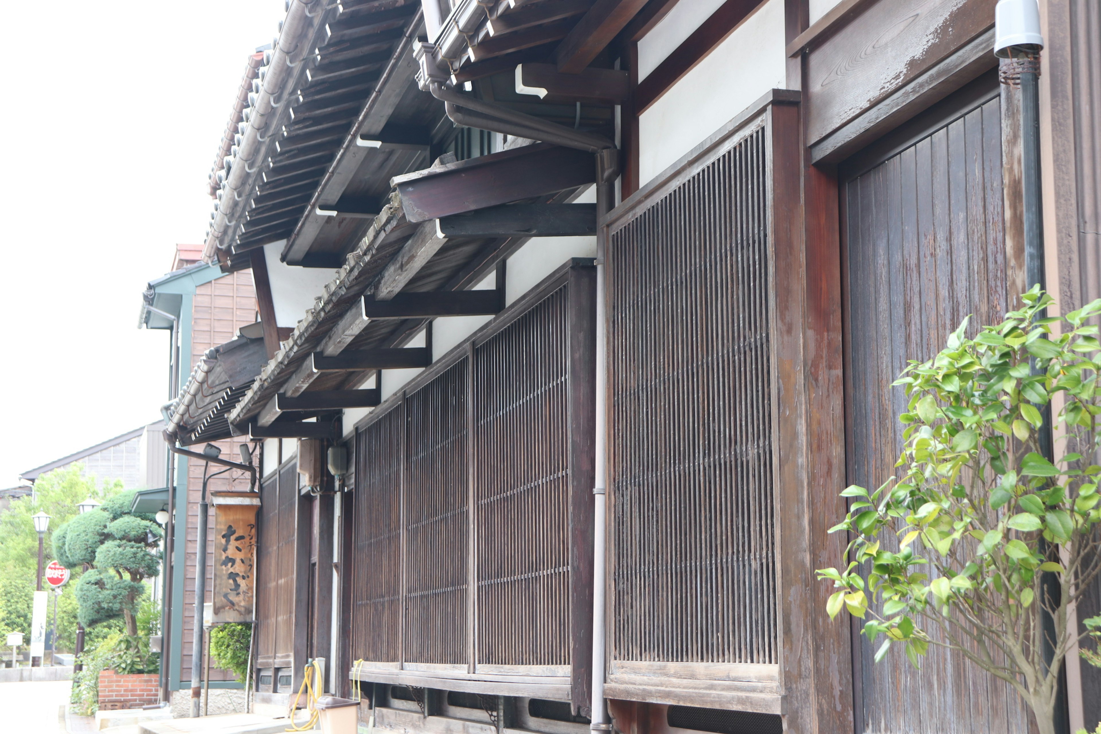 Traditional Japanese wooden building with distinctive walls and roof